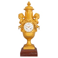  French Louis XVI Style Mid-19th Century Ormolu and Rouge Griotte Marble Clock