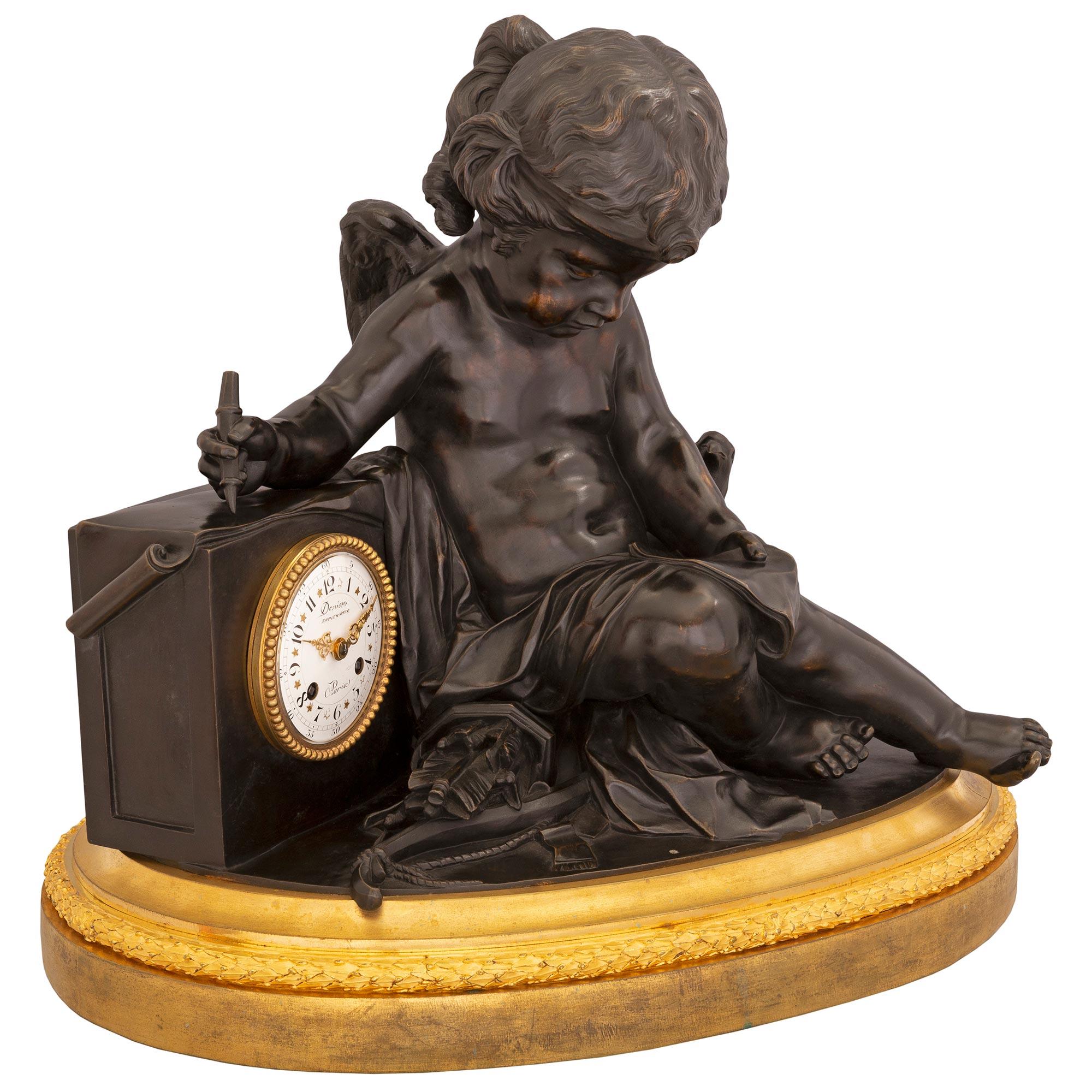 A charming and extremely high quality French 19th century Louis XVI st. ormolu and patinated bronze clock, signed Denière. The clock is raised by a fine oval shaped ormolu base with a richly chased wrap around berried laurel band and mottled border.