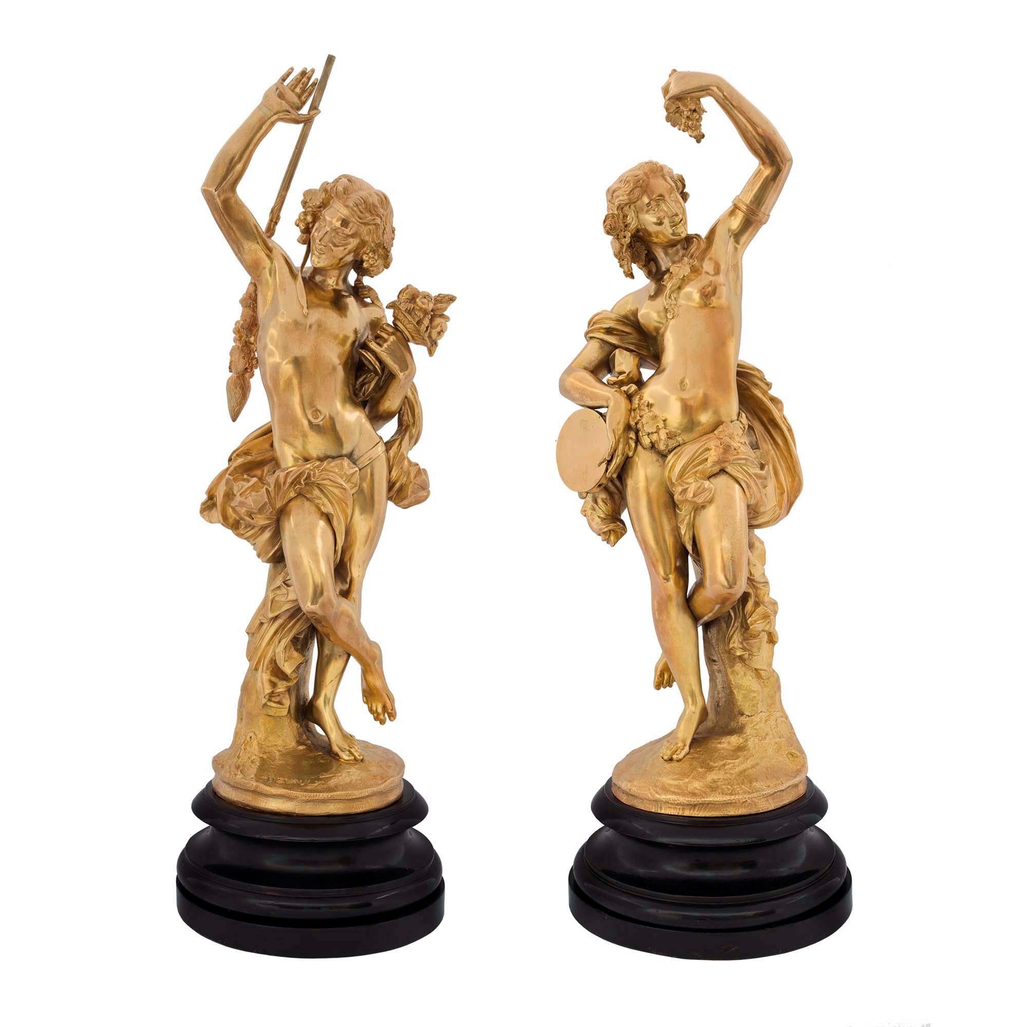Statues figuratives festives françaises en bronze doré de style Louis XVI, signées Devaulx
