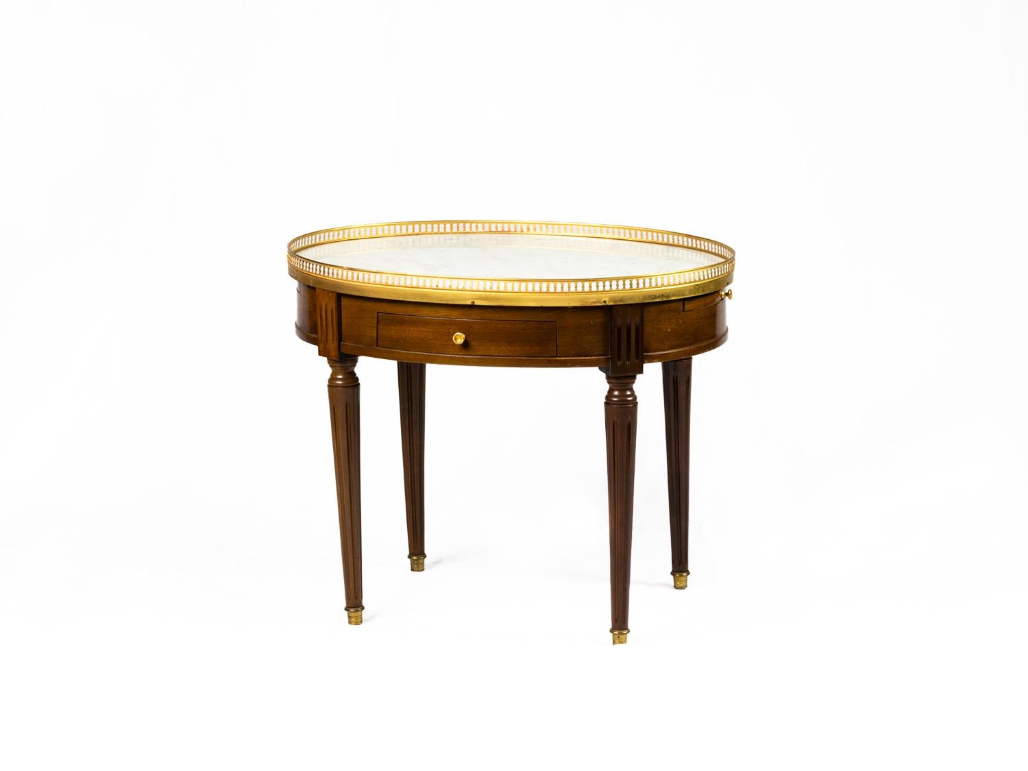 A unique 19th century Louis XVI Style mahogany oval side table Bouillotte.
Marble top, golden rail, two drawers and extensions on each side for glasses with leather lining.