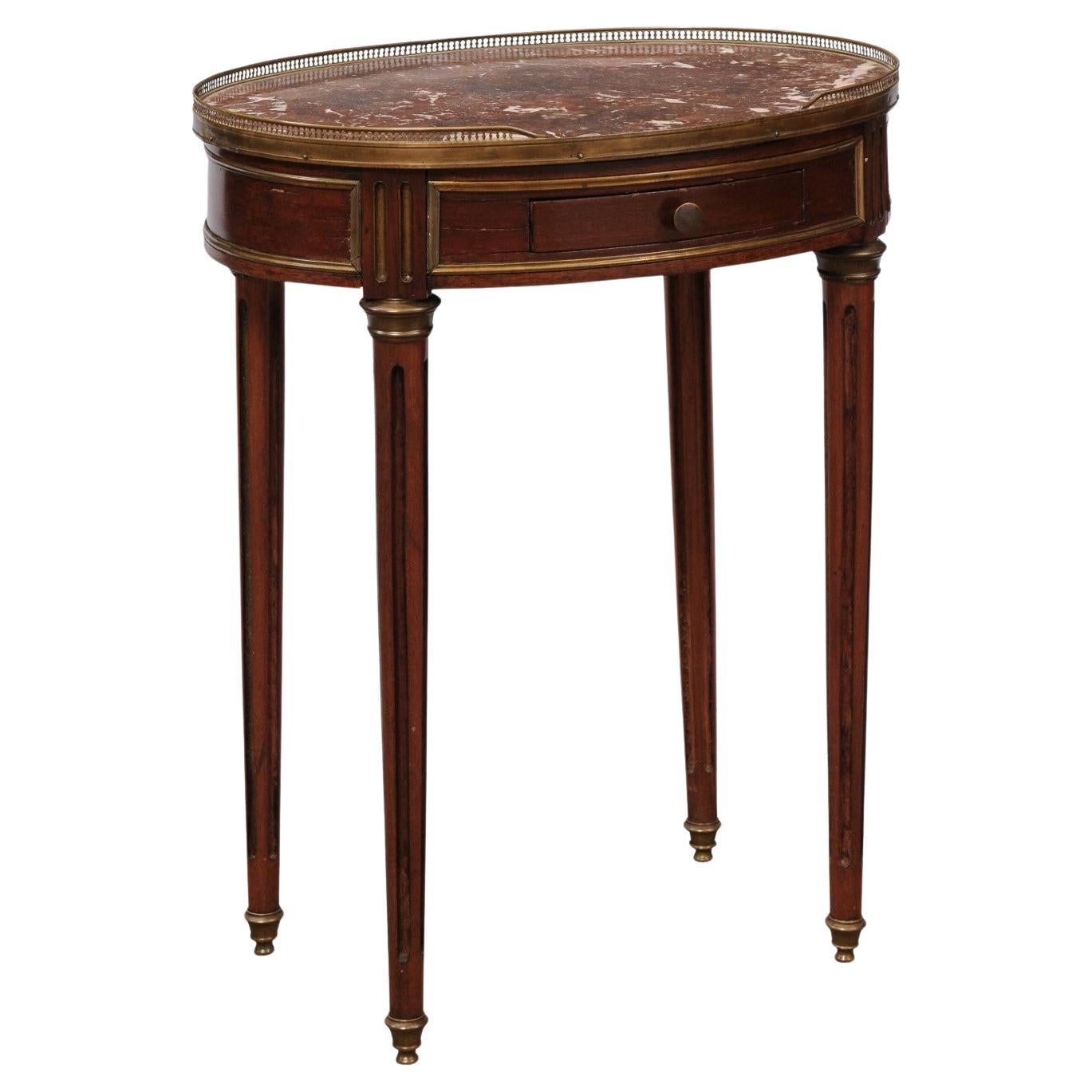 Französischer ovaler Mahagoni-Tisch im Louis-XVI-Stil mit "Rouge Royale"-Marmorplatte im Angebot