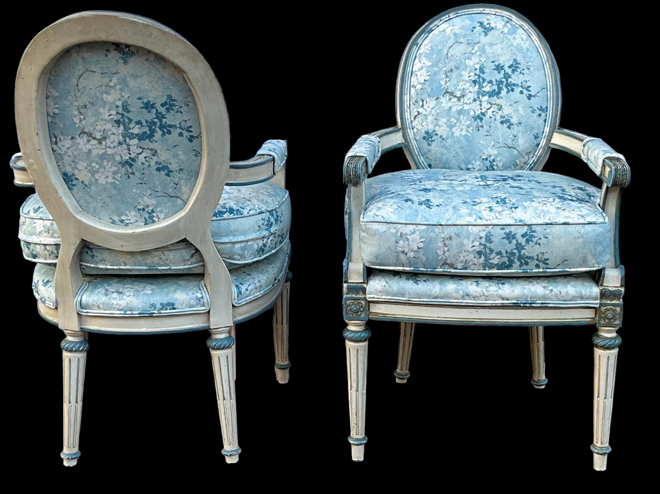 20th Century French Louis XVI Style Painted Blue Bergere Chairs In Floral Upholstery- Pair For Sale