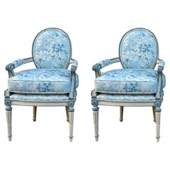 French Louis XVI Style Painted Blue Bergere Chairs In Floral Upholstery- Pair