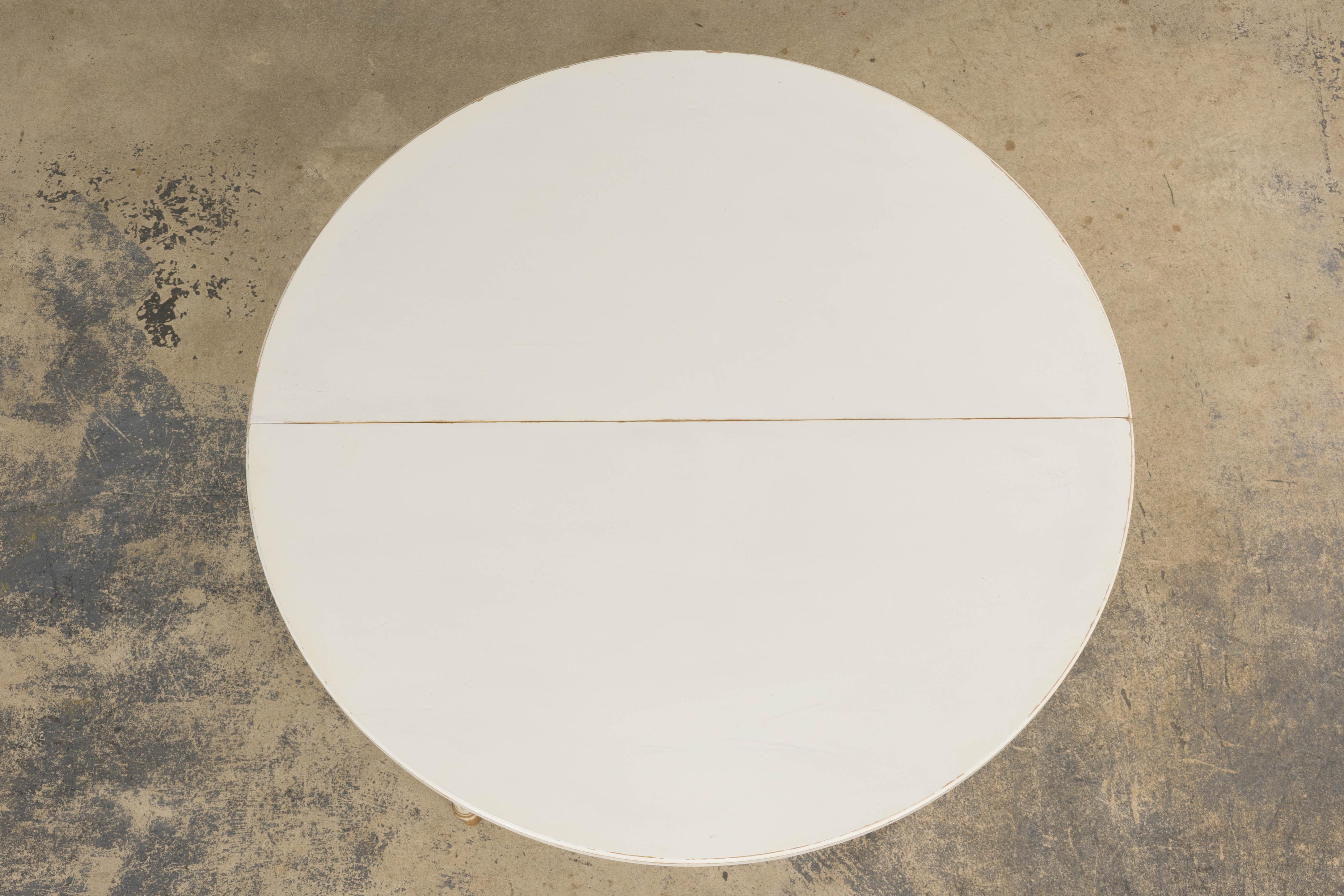 French Louis XVI Style Painted White Off-Round Extendable Dining Table In Good Condition For Sale In Astoria, NY