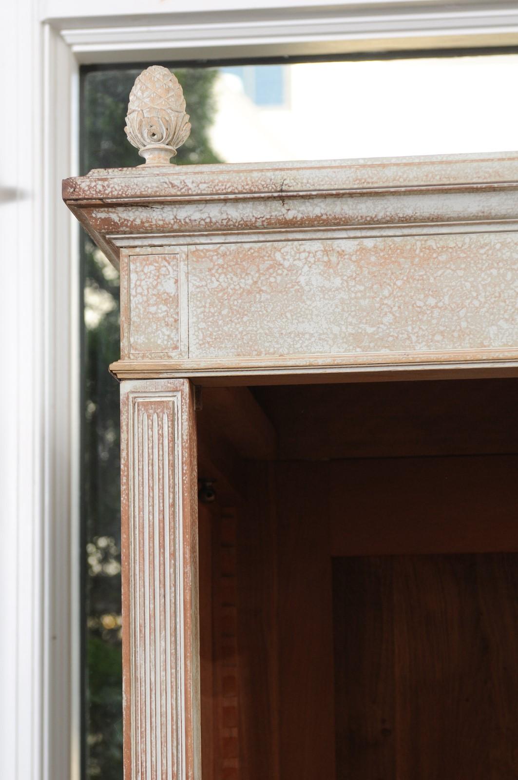 Carved French Louis XVI Style Painted Wood Cabinet with Glass Doors and Bonnet Cornice