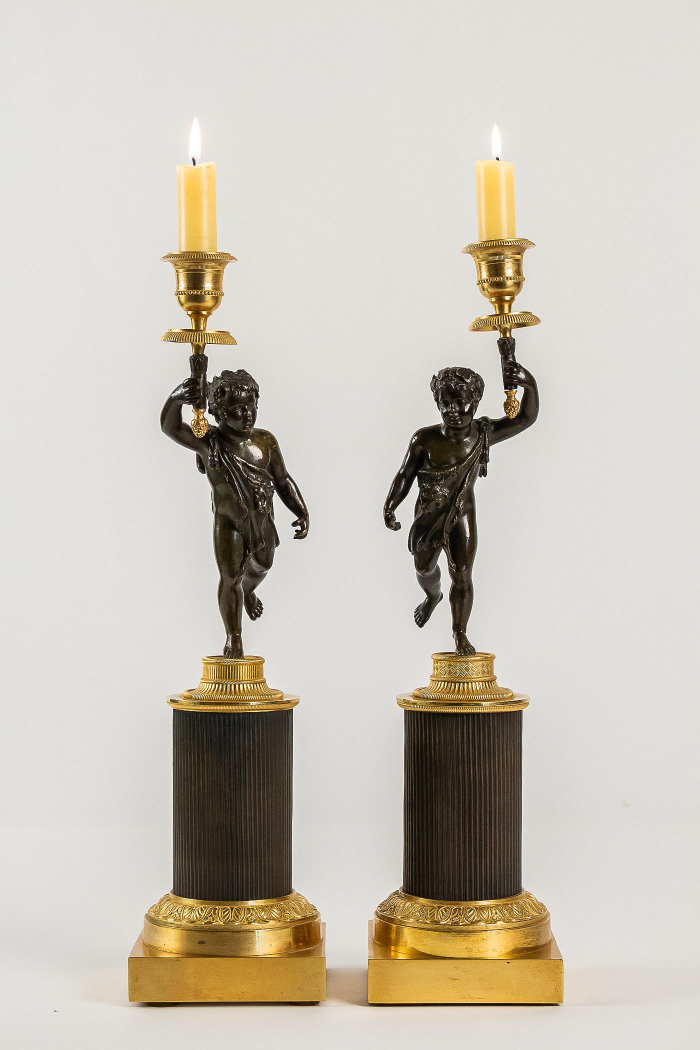 French Louis XVI style, pair of patinated and gilded candlesticks, circa 1880

A nicely elegant pair of finely chiseled mercury-gilt and patinated bronze candlesticks depicting antique Putti, resting on gilt and patinated bronze