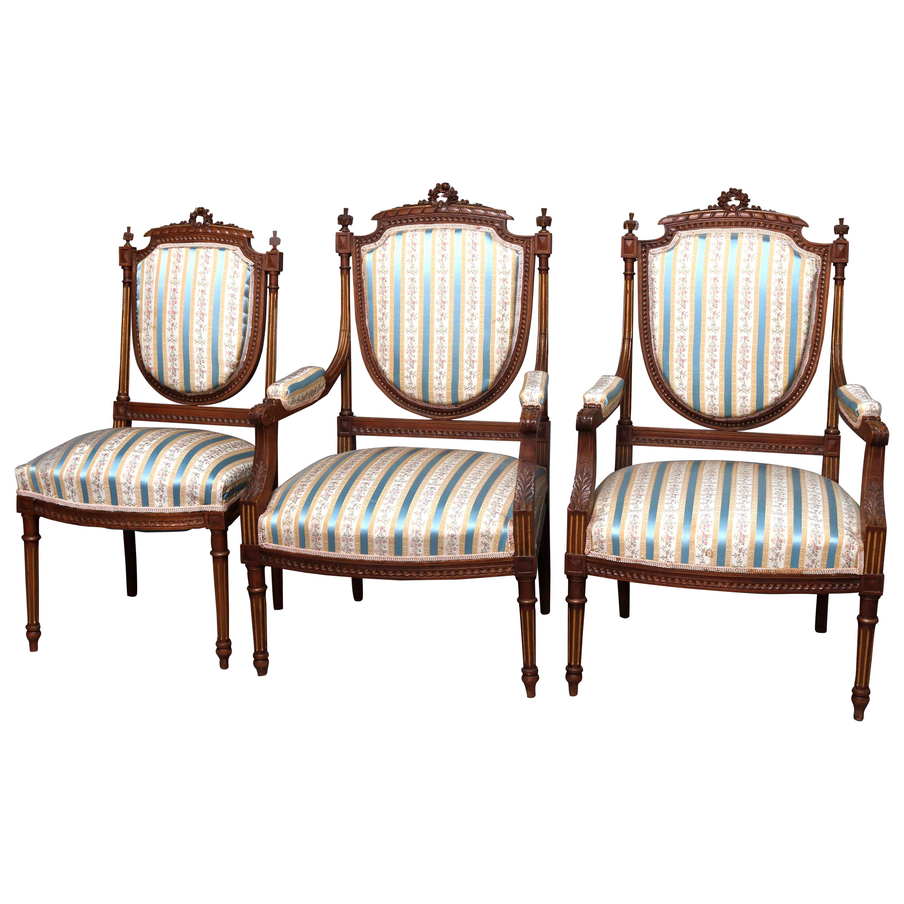 French Louis XVI Style Parcel-Gilt Carved Walnut Parlor Set, 19th Century