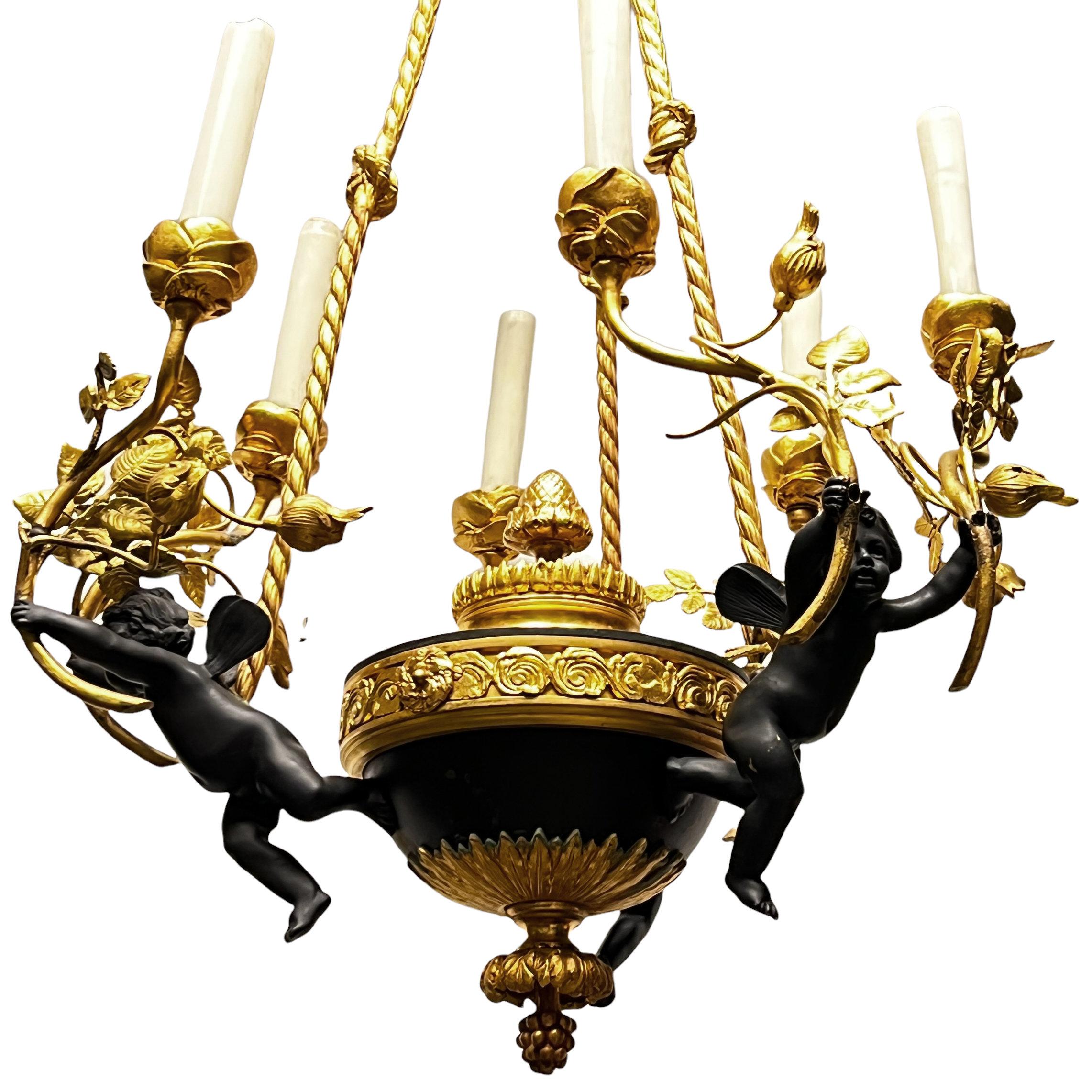 Very fine quality French turn of the century Louis XVI style patinated bronze six-light putti motif chandelier.