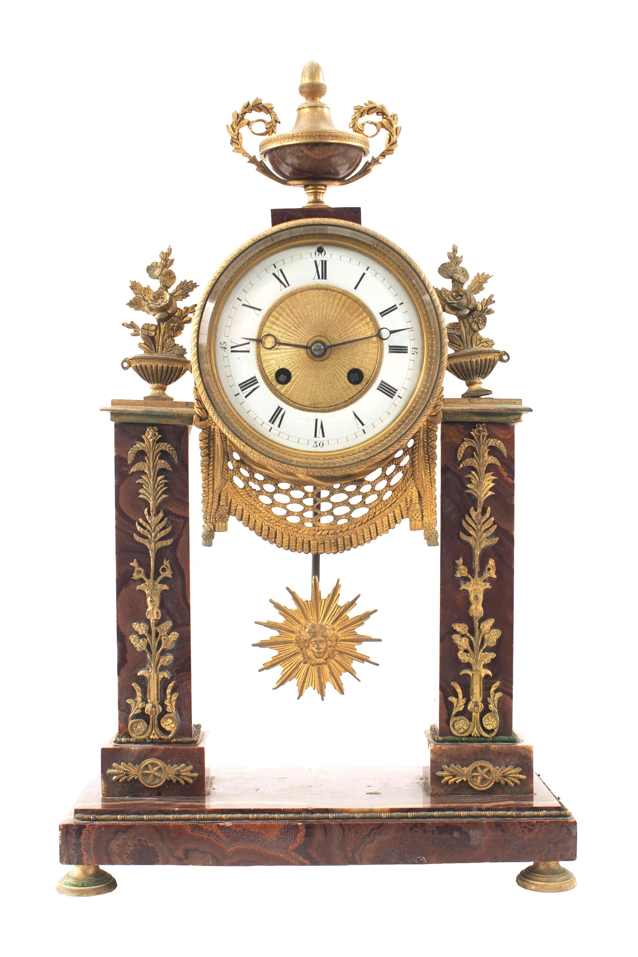3-Piece French Louis XVI-style (19th Century) rouge marble and bronze dore clock set with Pair of candelabra. (18