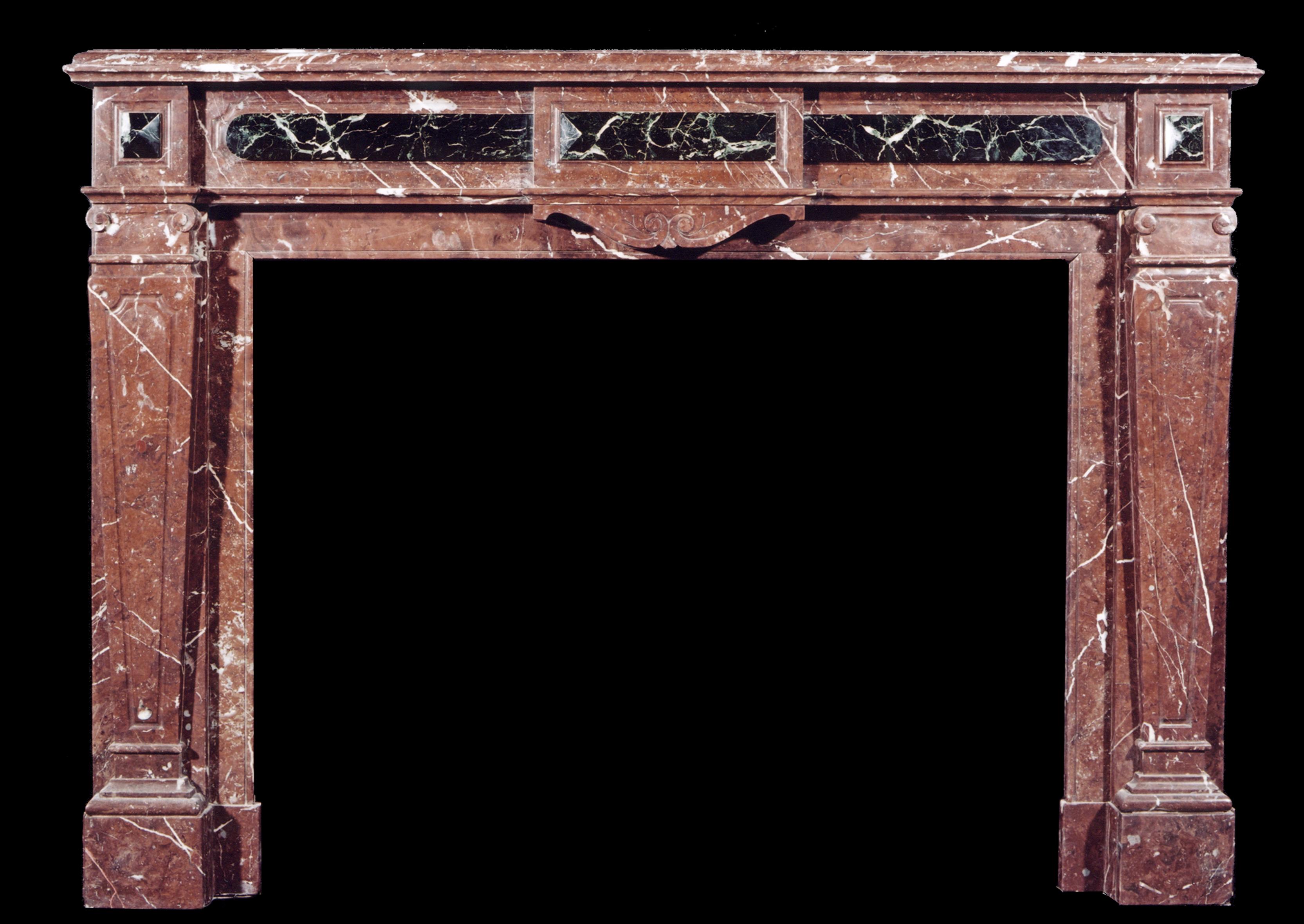 A 19th century French Louis XVI Rouge Royale and inlaid dark green marble fireplace, with panelled tapering jambs, surmounted by scroll capitals and moulded rectangular shelf.

Measures: 
Shelf Width:	1535 mm      	60 3/8 in
Overall Height:	1105 mm 