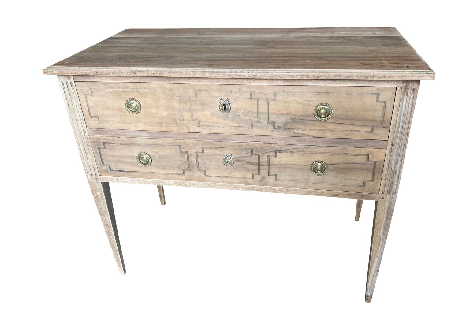 A very lovely Louis XVI style Sautuese commode from the Provence region of France. Beautifully constructed from walnut with 2 drawers over tapered legs. Perfect as a bedside cabinet or converted into a bathroom vanity.