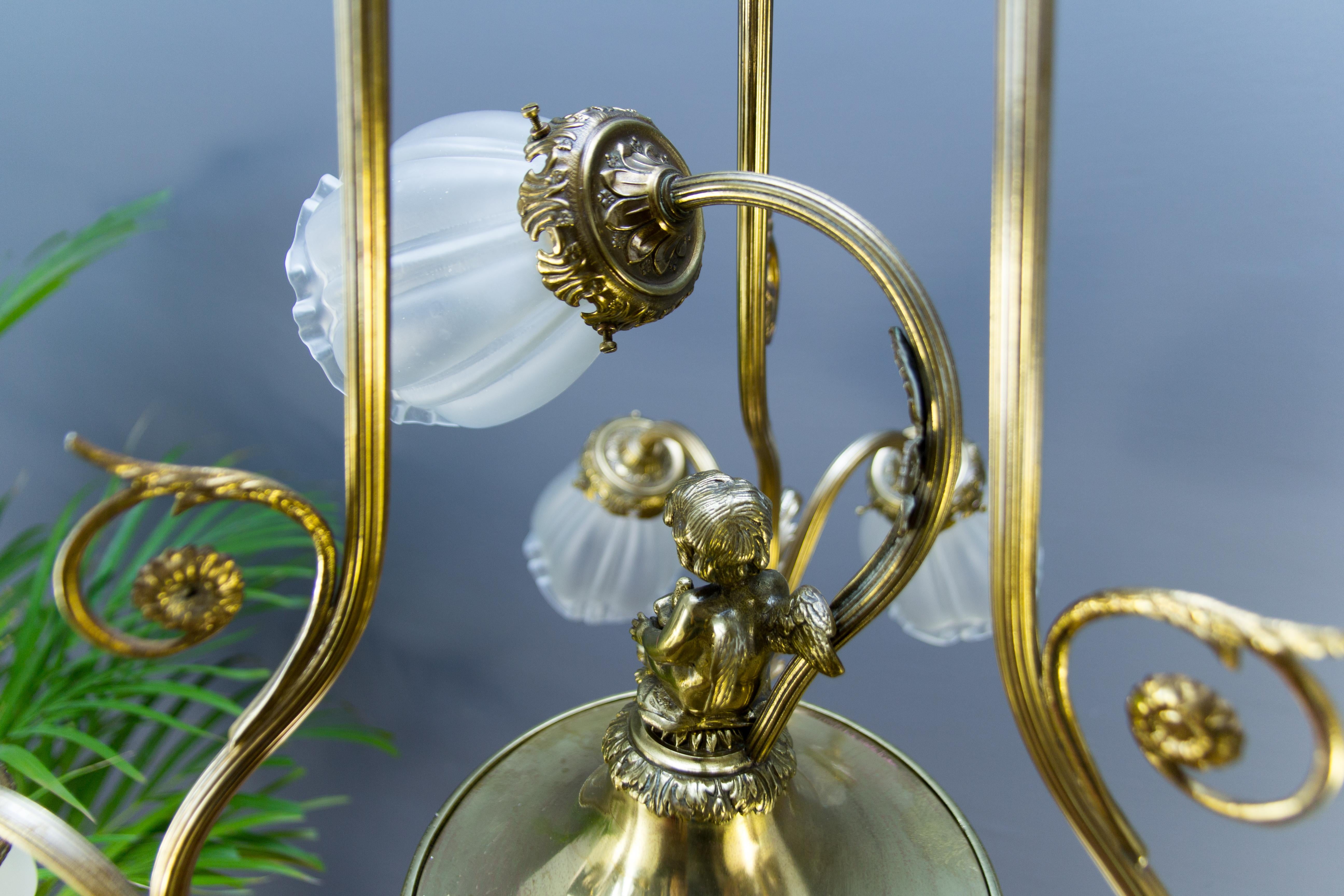 French Louis XVI Style Seven-Light Brass, Bronze and Glass Cherub Chandelier 13