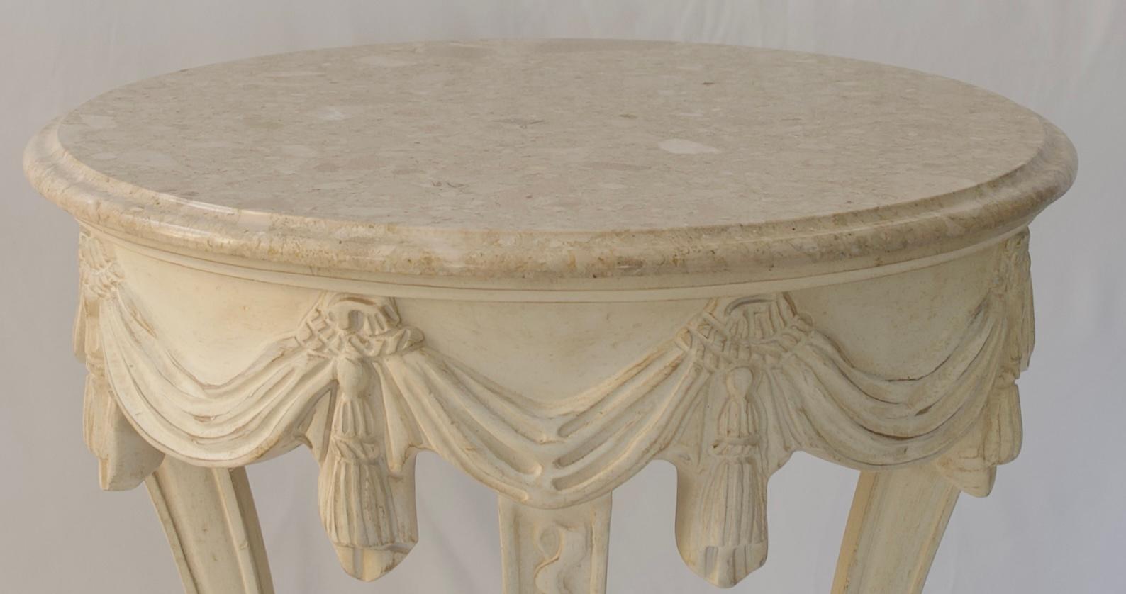 Vintage French Louis XVI style side table with a beige Italian marble top. 
The motifs around the top and the curved legs make this stylish French Louis XVI style side table particularly appealing. 
Hand-carved motifs on the apron resembling