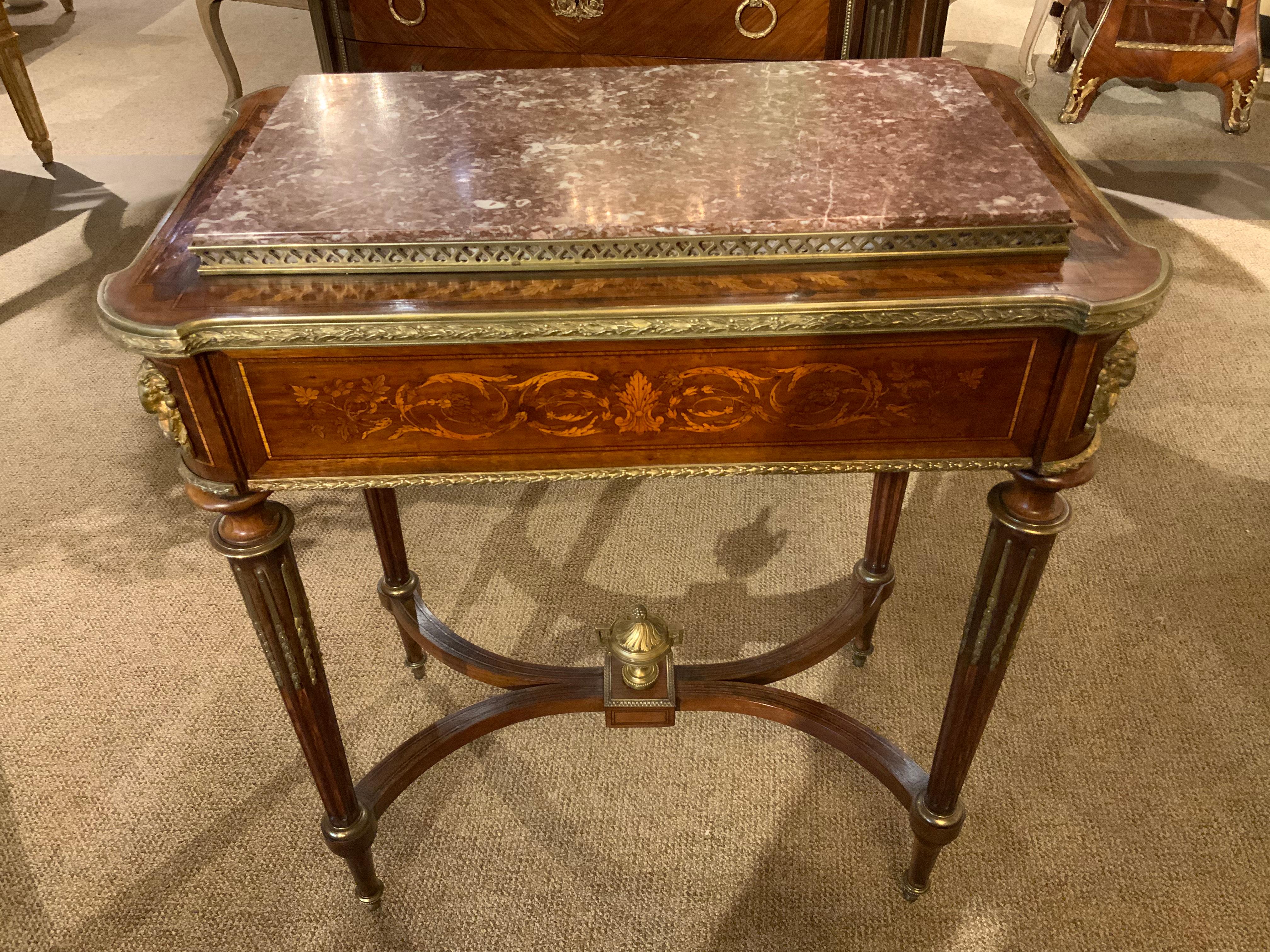 The exceptional construction and fine cabinetry makes this
Special. The quality of the inlaid marquetry is also beautifully 
Done. The grill work is a soft gold hue and adds a special
Design touch to this side table. It is raised on tapering