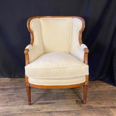French Louis XVI Style Two Piece Bergere Chair and Ottoman Set Duchesse Brisee