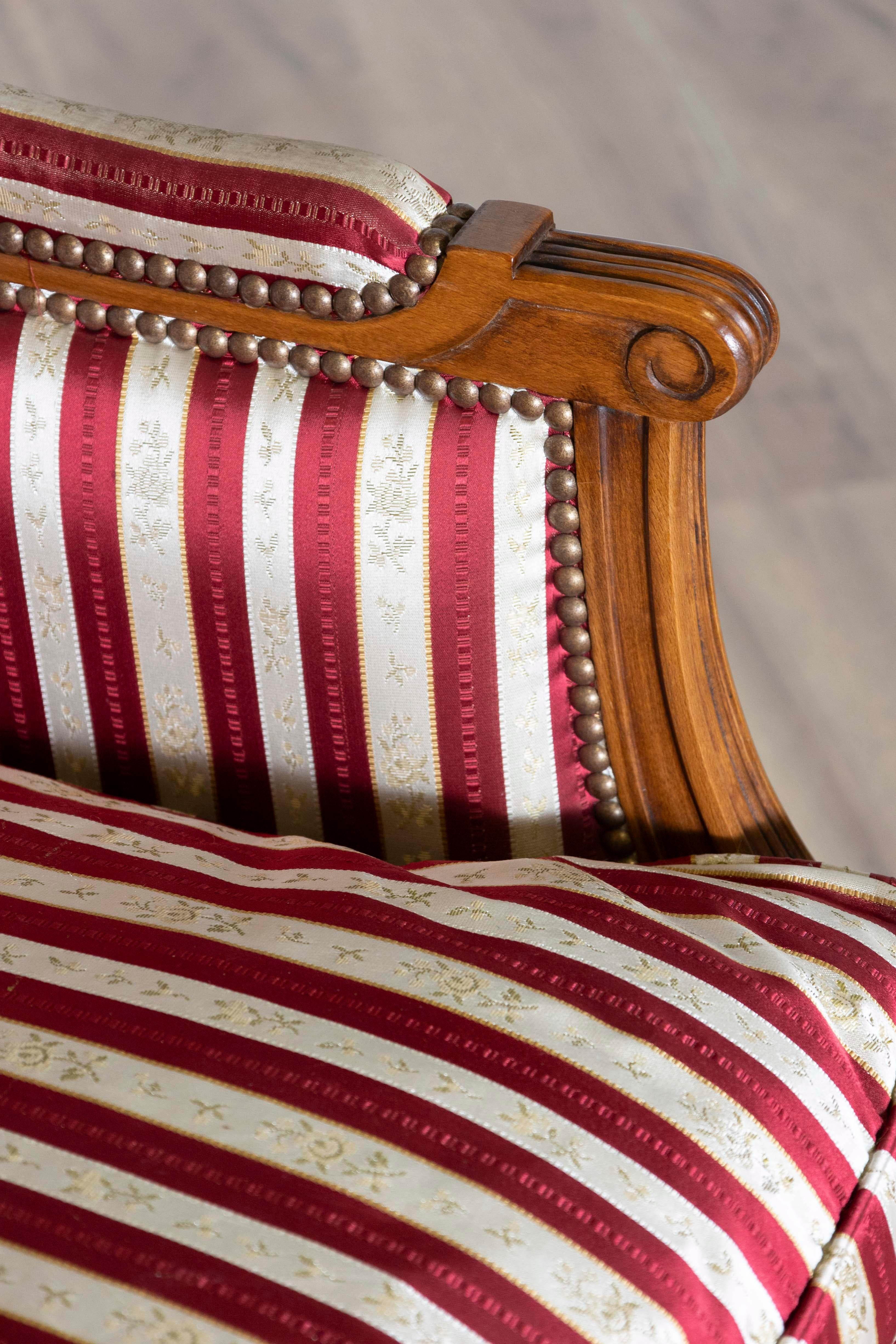 20th Century French Louis XVI Style Walnut Bergères à Oreilles with Fluted Legs, a Pair For Sale