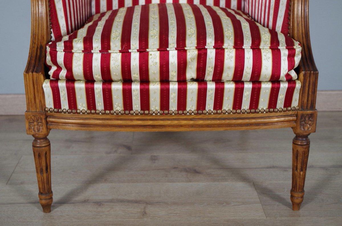 Upholstery French Louis XVI Style Walnut Bergères à Oreilles with Fluted Legs, a Pair For Sale