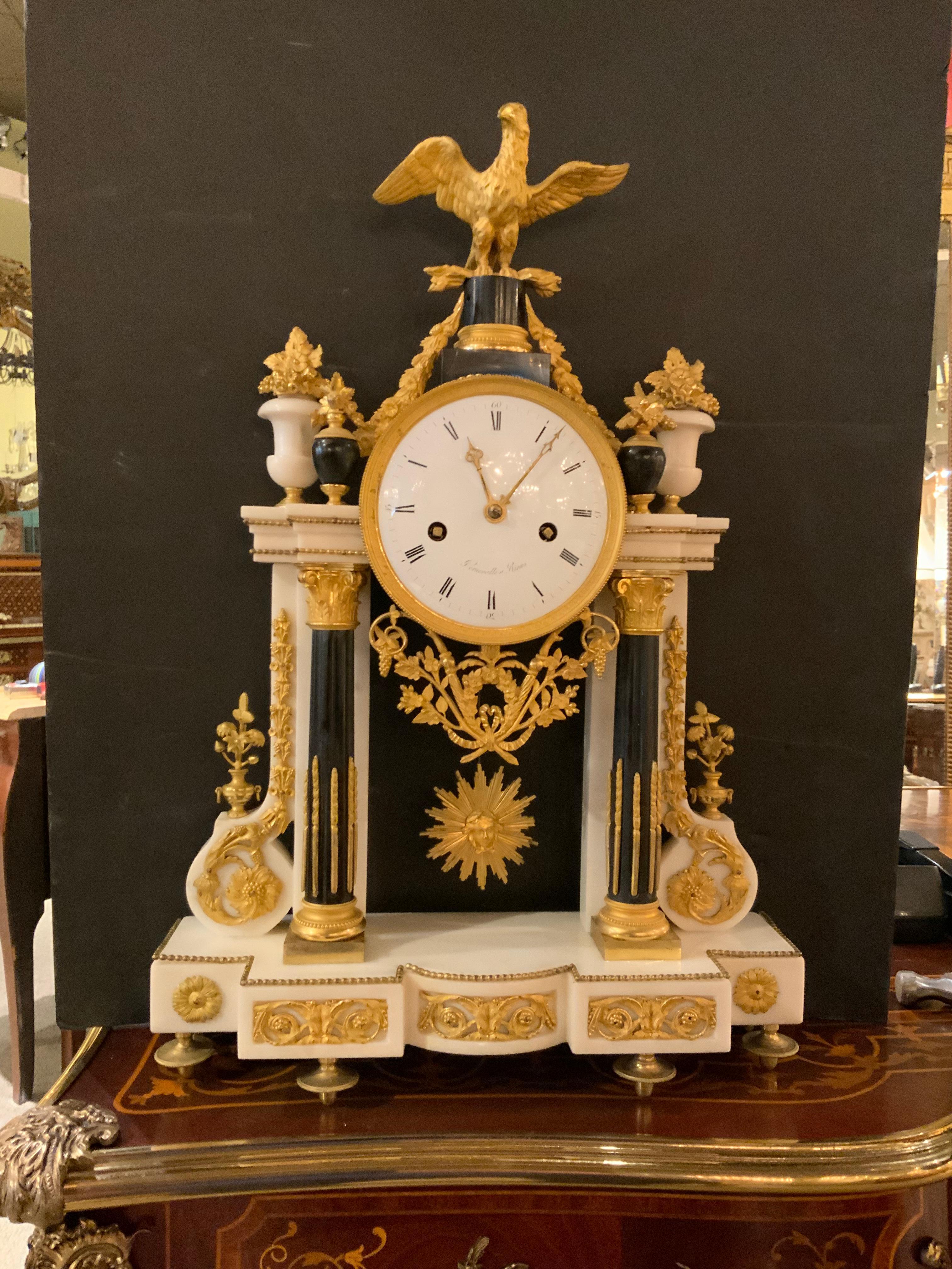 Exceptional because it is a beautiful case of Carrara marble with black
Fluted columns, with bronze dore eagle crest, framed by urns filled with fruit
And flowers, white enamel dial with Roman numeral hour markers, signed
persevalle a Reims, time