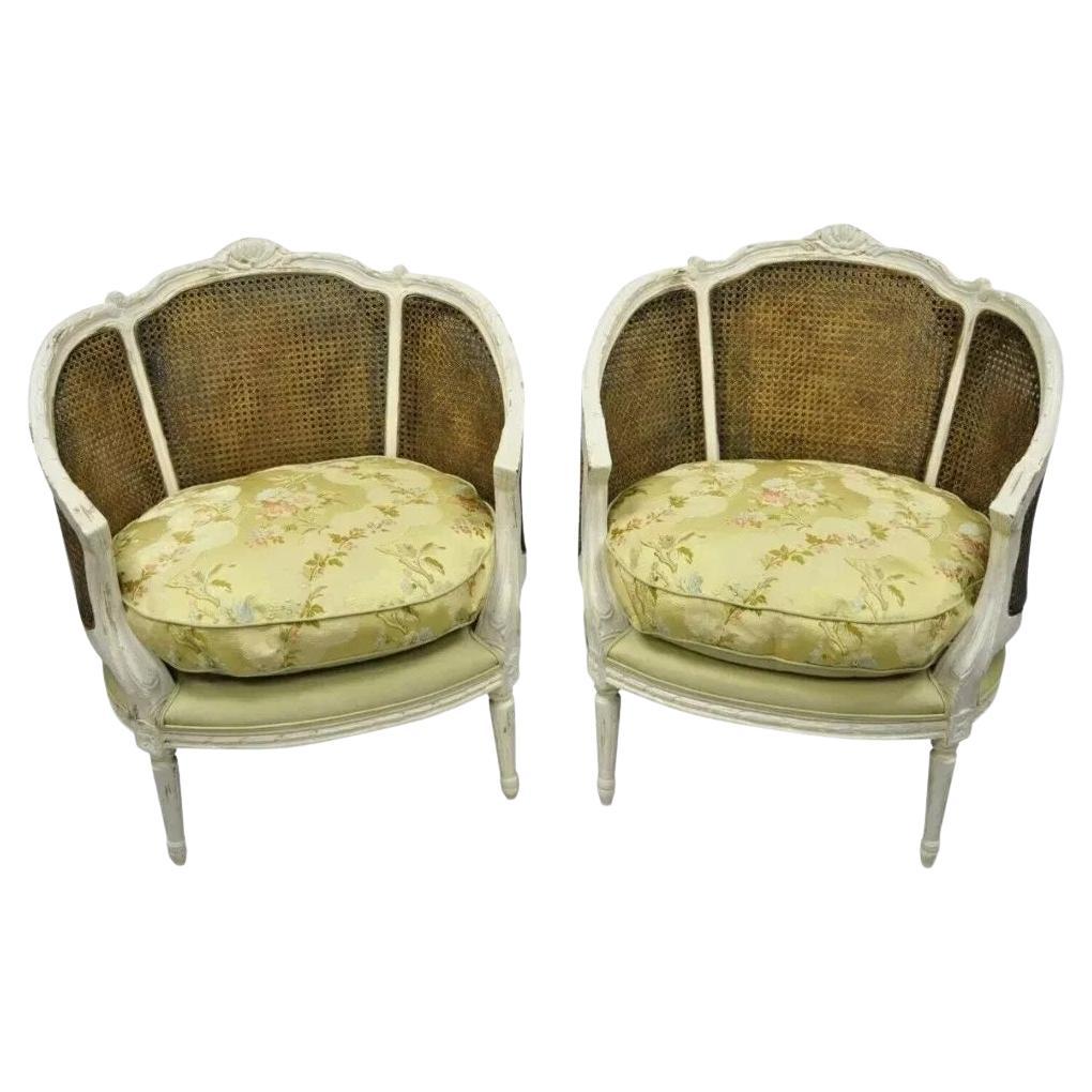 French Louis XVI Style White Distress Painted Cane Bergere Club Chairs - a Pair