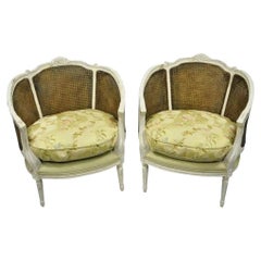 French Louis XVI Style White Distress Painted Cane Bergere Club Chairs - a Pair