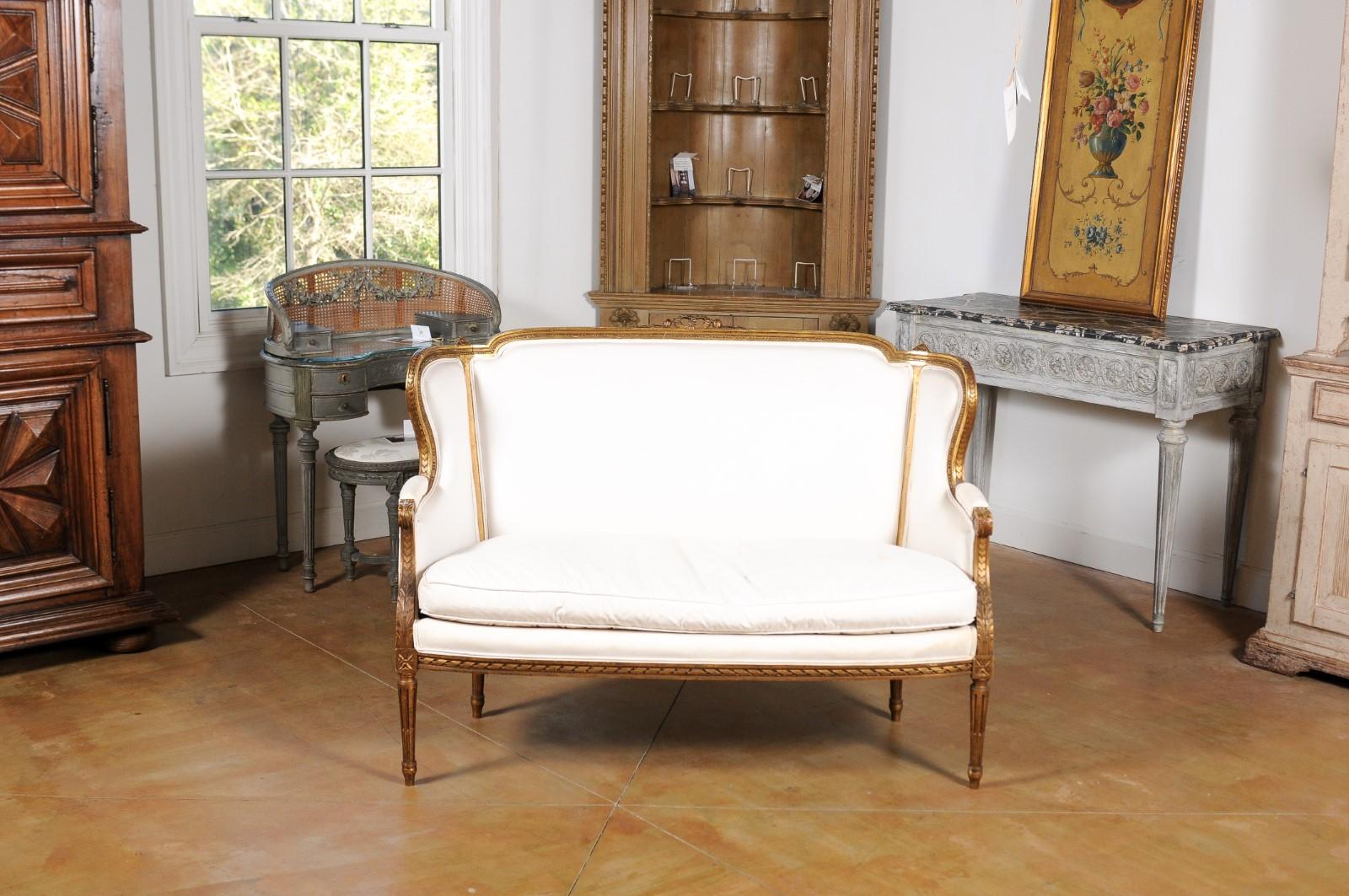 Carved French Louis XVI Style Wingback Settee with Original Gilding and New Fabric