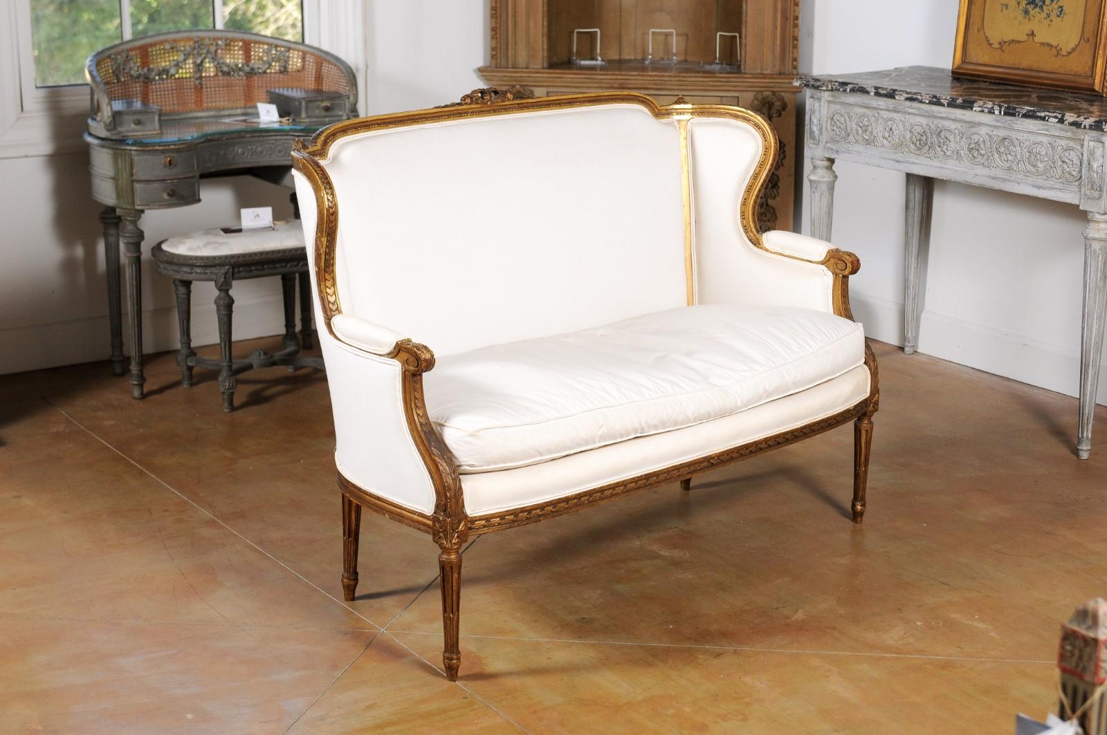 French Louis XVI Style Wingback Settee with Original Gilding and New Fabric In Good Condition In Atlanta, GA