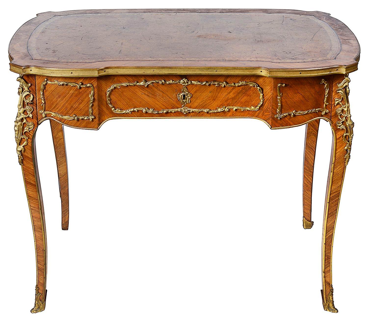A very good quality late 19th Century French Mahogany bureau plat in the style of Louis XVI.
Having an inset leather top, a frieze drawer, gilded ormolu mounts and raised on elegant cabriole legs, terminating in scrolling ormolu feet.

Batch 80 MF