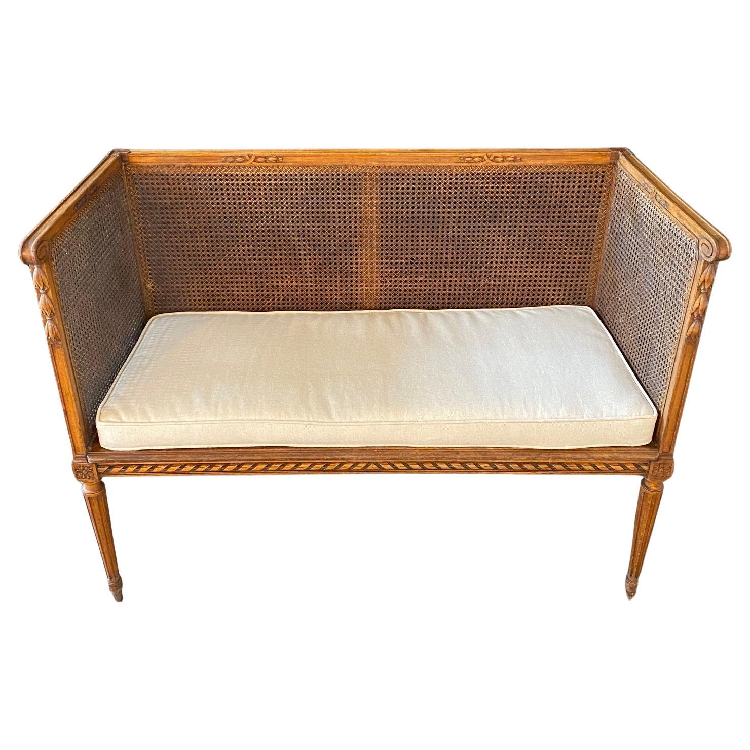 French Louis XVI Walnut and Double Caned Loveseat For Sale