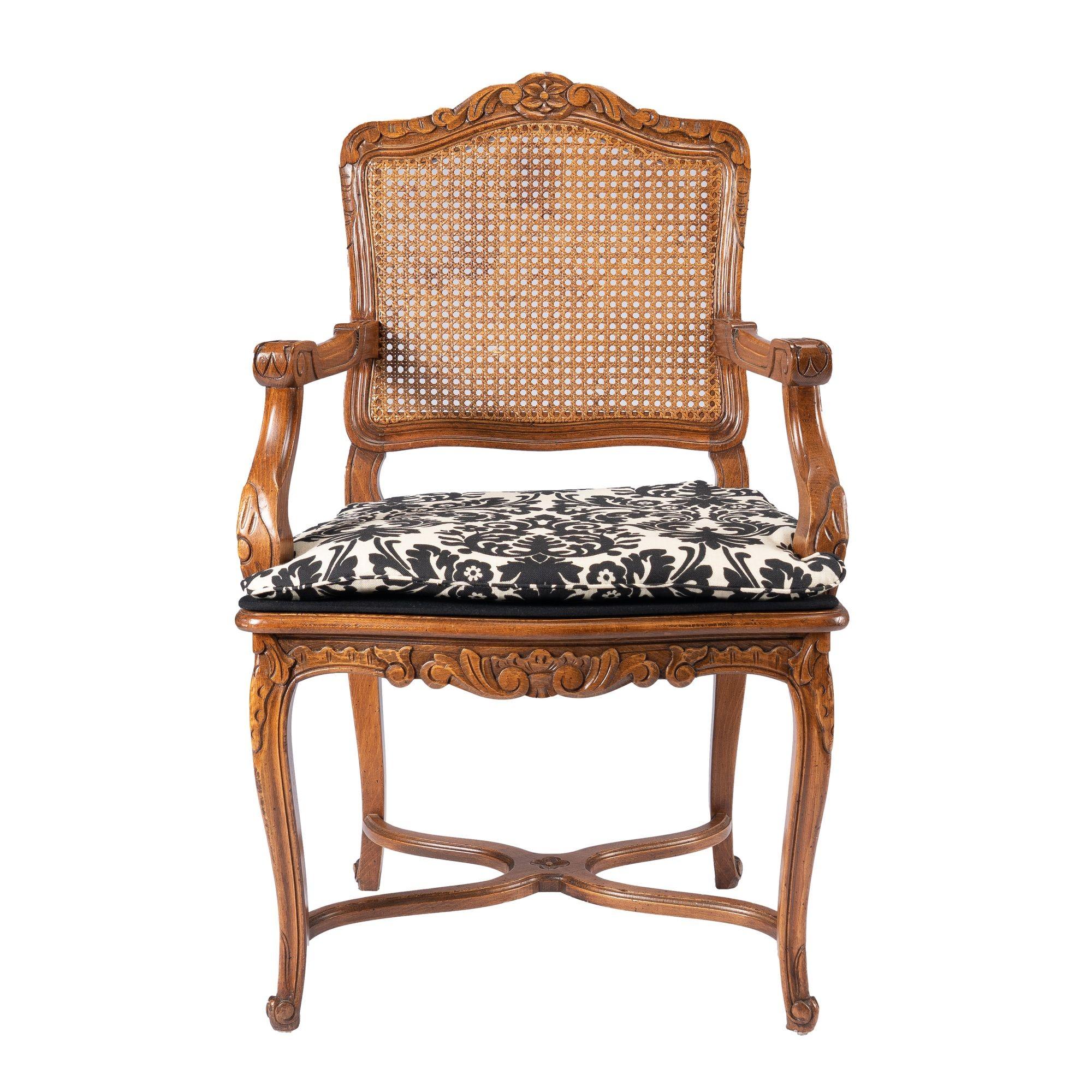 Academic Revival, Louis XVI style fauteuil with a caned seat & back panel, fitted with an upholstered seat cushion and upholstered seat platform.
France, early 20th century.

Dimensions: 24” W x 18-3/4” D x 38” H
27” (arm height)
20” (seat