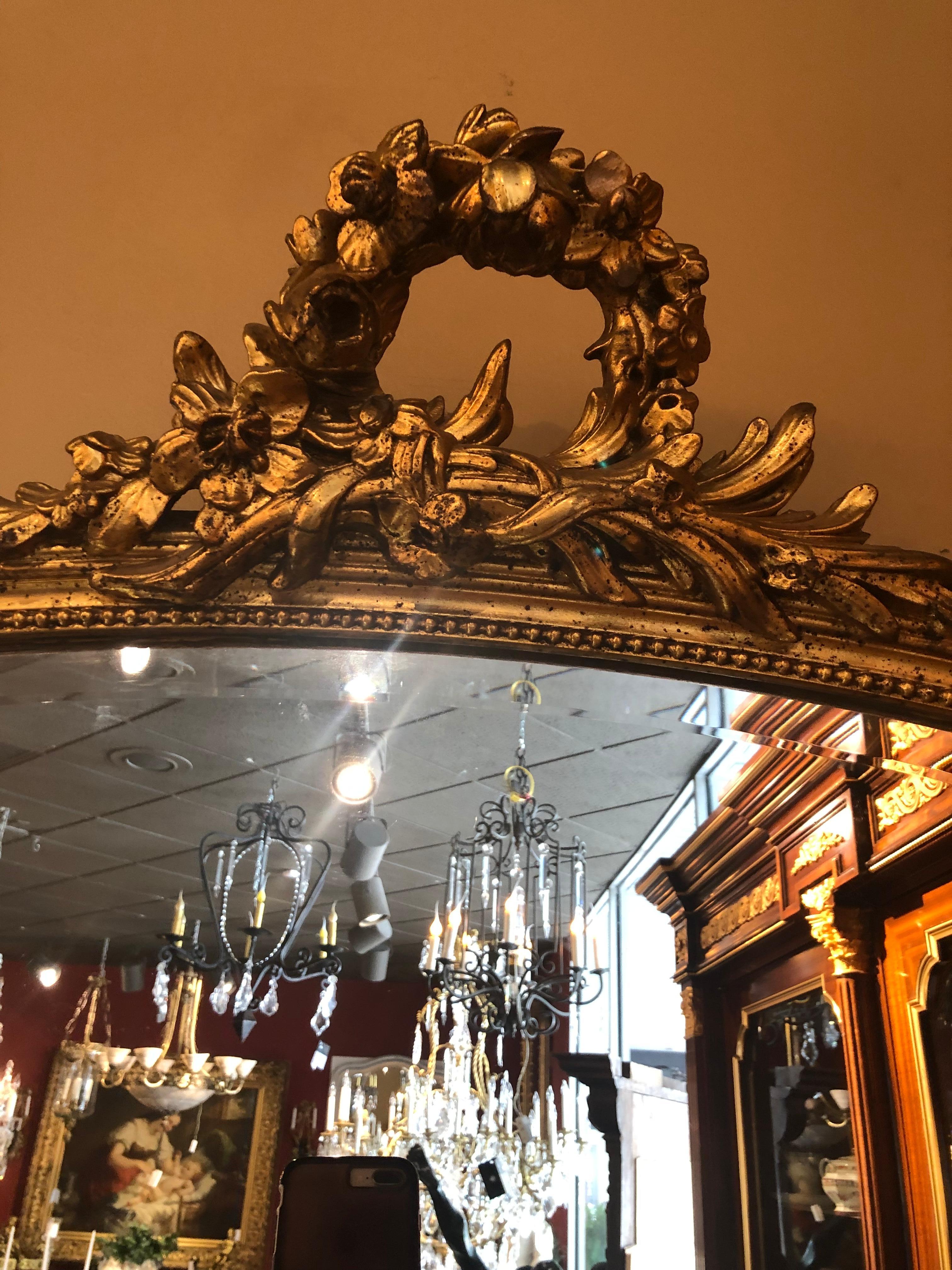 Louis XVI French Louisxvi Style Giltwood Mirror, 19th c. Having a Floral Crest, Beveled For Sale
