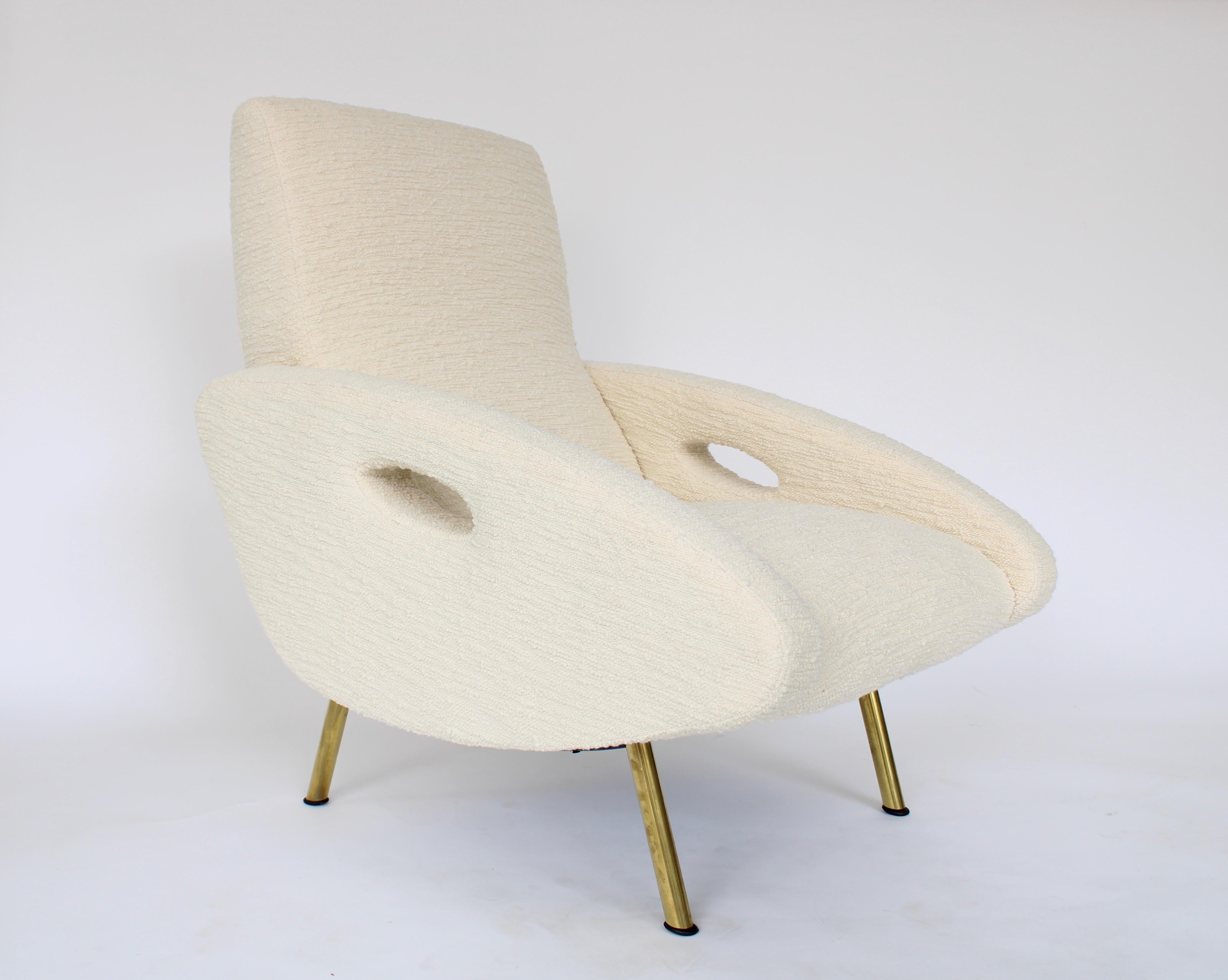 Pair of French lounge chairs designed by Francois Letourneur and edited by Maurice Mourra, Paris and are expertly reupholstered in cream Judith boucle by Pierre Frey. 
These chairs are rare and are an iconic design by Letourneur. 
The large curved