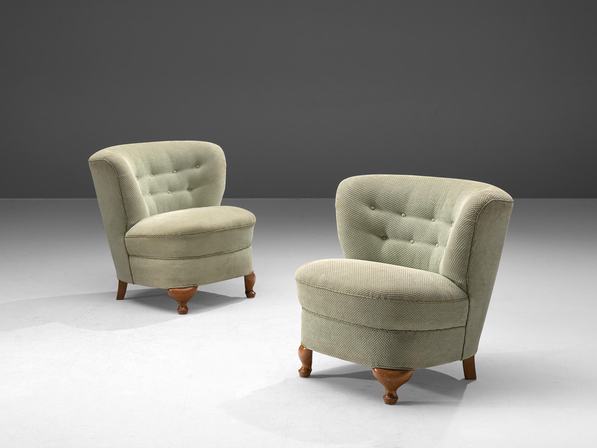 Living room set, fabric and wood, France, 1960s

This elegant lounge set, consisting of two easy chairs and one sofa, is bold and round. The backrests flow slightly outwards when seen from the seat which is the reason that this chair has a very