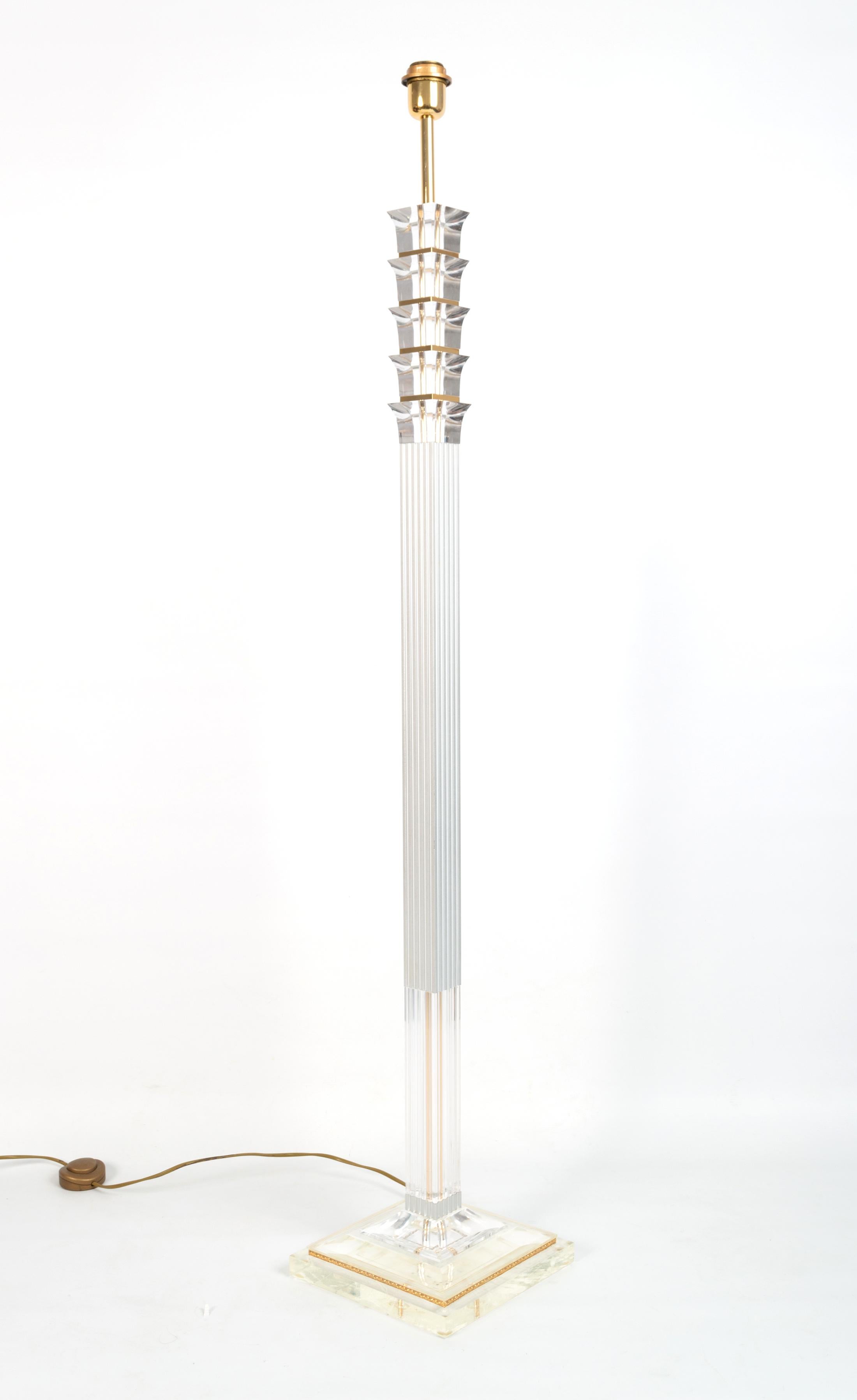 A French lucite and gilt floor lamp C.1970
Elegant Hollywood Regency neo-classical Design
In excellent condition commensurate of age.