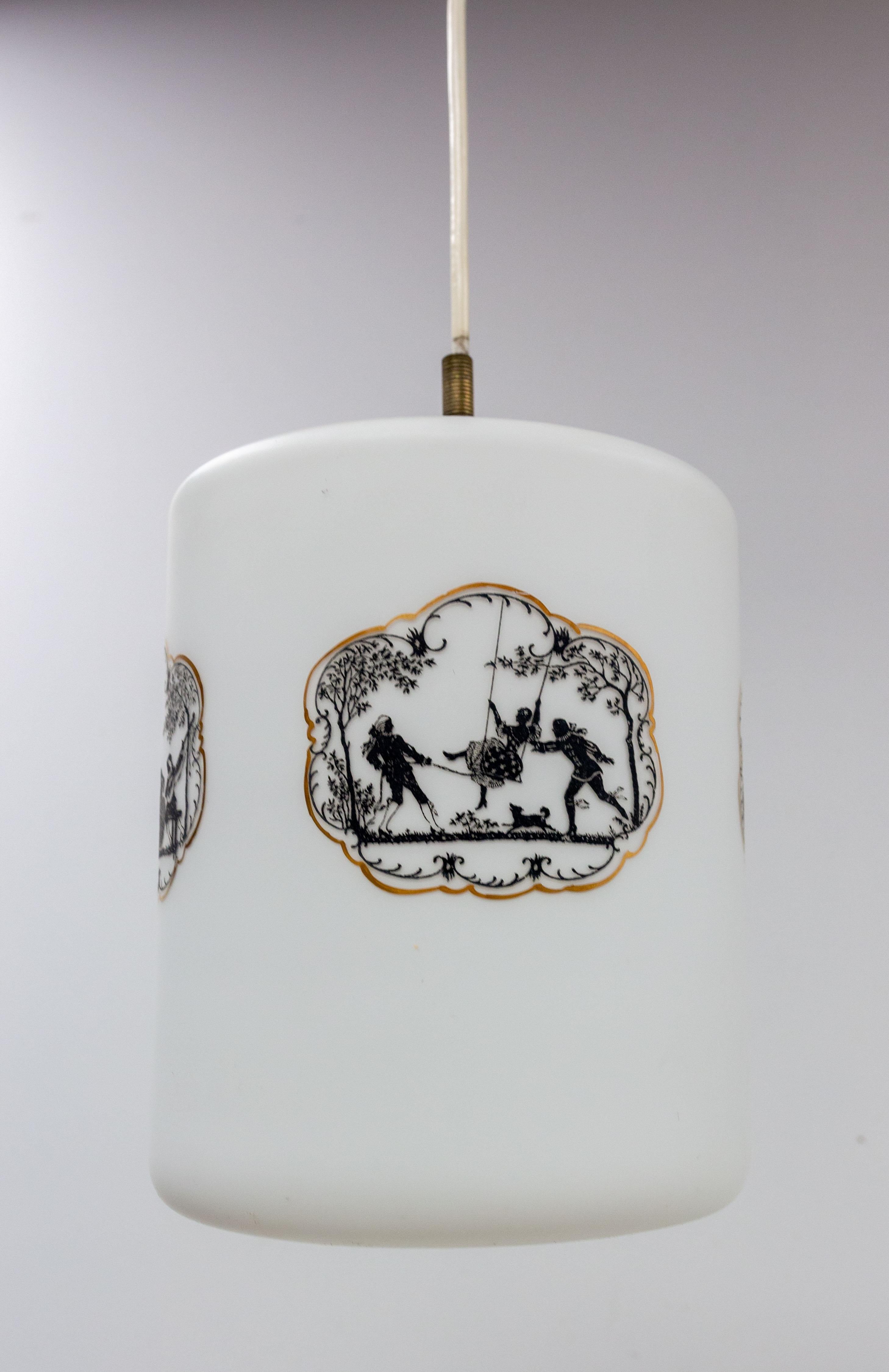 Ceiling pendant lamp in glass mid-century
The illustrations represent two romantic scenes. One scene represents two men with a woman on a swing and a dog. The second picture represents a a dance scene with two musicians and two women.
Good vintage