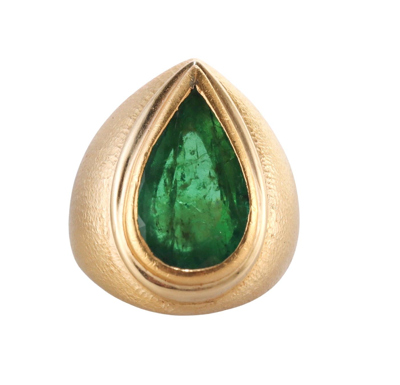 French made vintage 18k gold hand hammered ring, set in the center with a pear shaped approx. 4.75ct emerald ( stone measures 17.6 x 10.4 x 5.2mm). Ring size 4.75, top is 25mm wide. Marked with an Eagle mark on the outside of the shank. Weight -