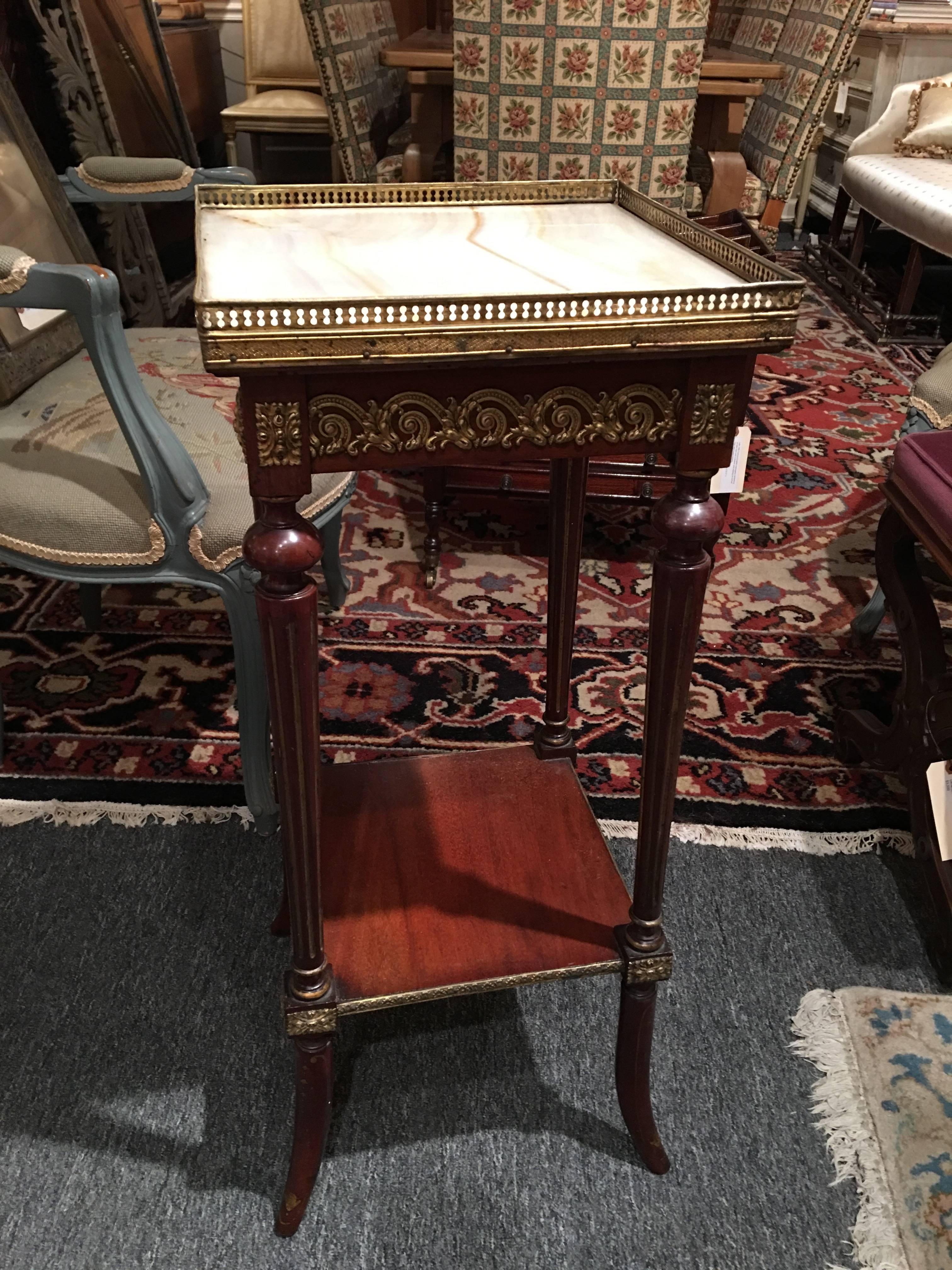 French mahogany and marble-top plant stand with brass gallery, 19th century.