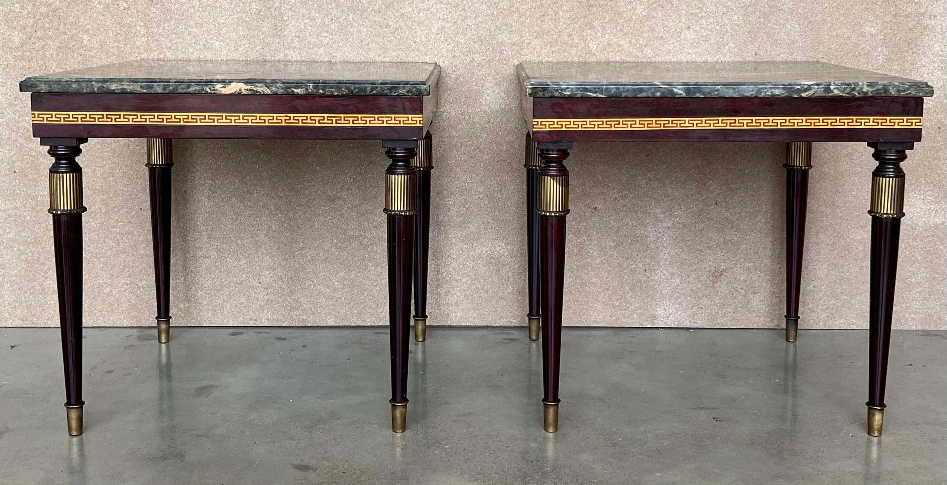 This elegant set of Louis XV style tables with marble top are made of mahogany with marquetry in four sides edges, with four tapered legs. The tables has exquisite detailed bronze mounts and marble top.

