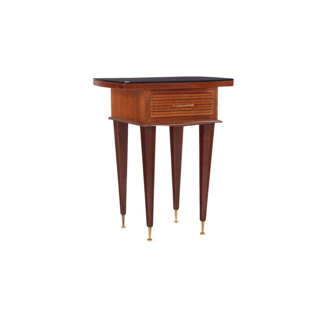 Two mid century French mahogany and opaline side tables with dovetailed drawers. This pair of end tables has brass hardware and feet, complimenting the mahogany wood. They could be used in the living room or bedroom as nightstands.