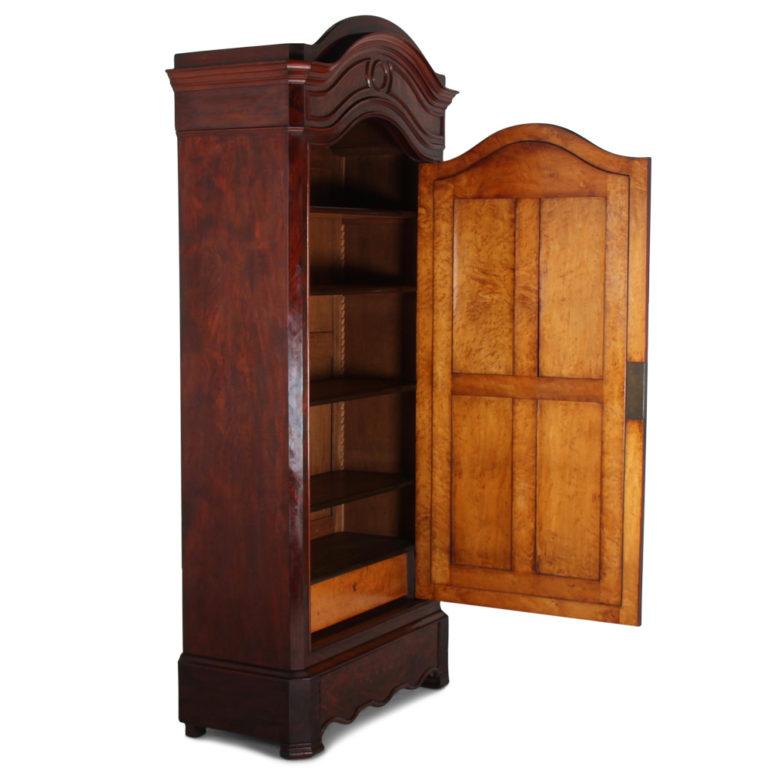 A French, flame mahogany, single-mirror-door armoire fitted with interior shelves. This late 19th century piece has beautiful original patina and colour, circa 1880.

 