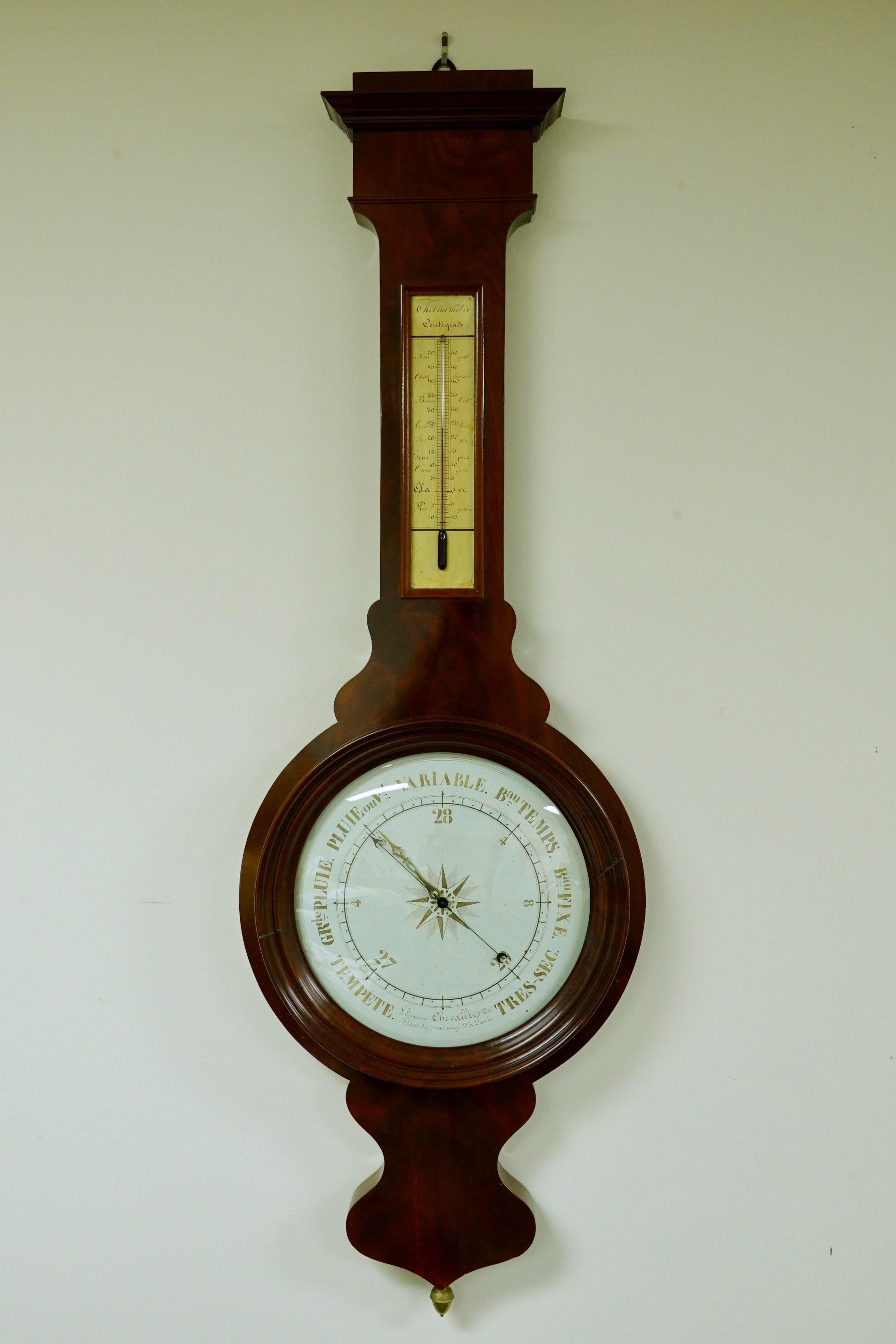 Impressive French mahogany barometer and thermometer from the Louis-Philippe period (Circa 1840), by Jean Gabriel Augustin Chevalliier. The barometer features an indicator arrow adjusted by an acorn finial at the bottom of the case. The dial is