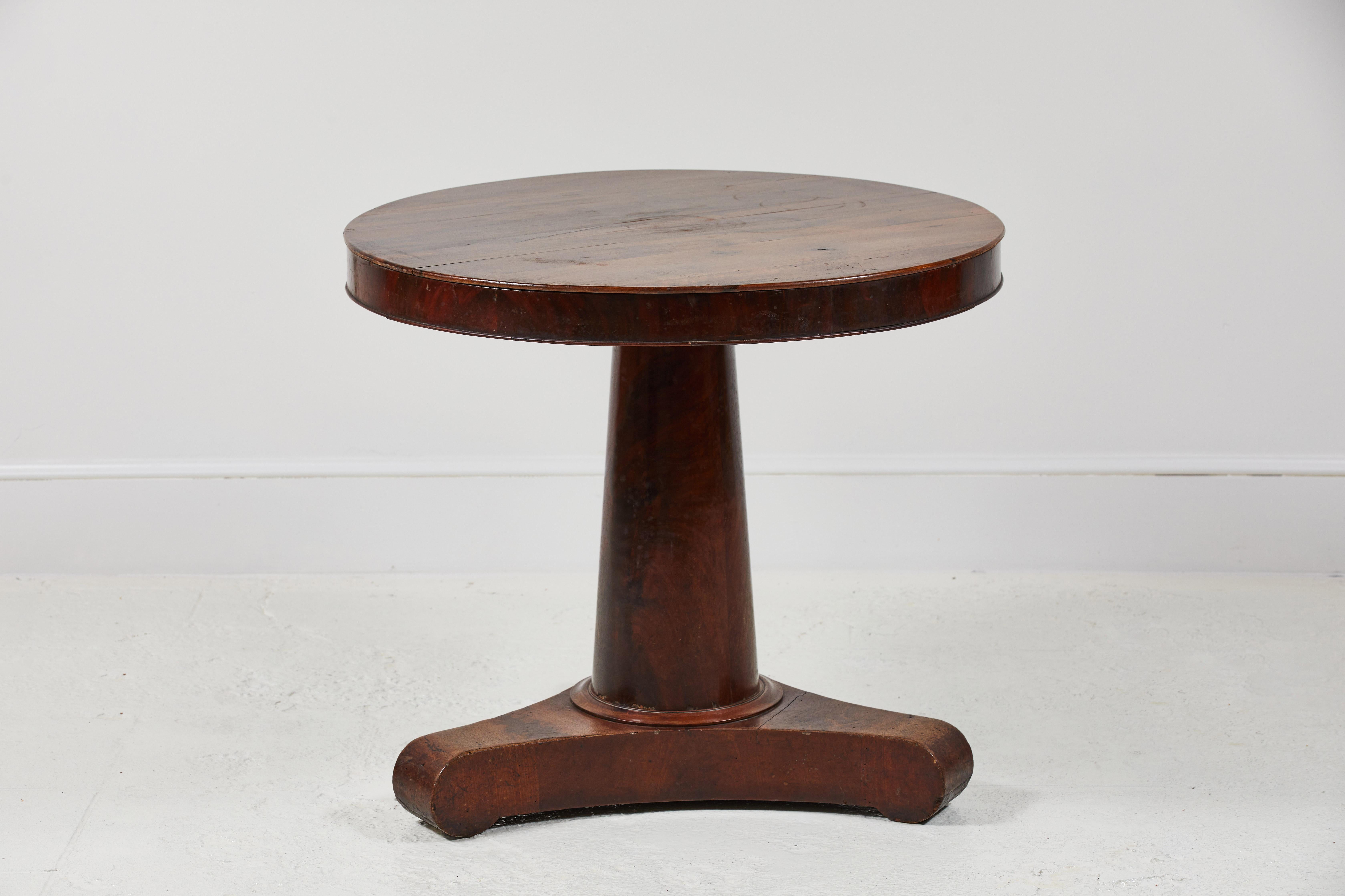 Beautiful French mahogany pedestal table with three feet. The table makes for a great hall table, entry table or corner table.