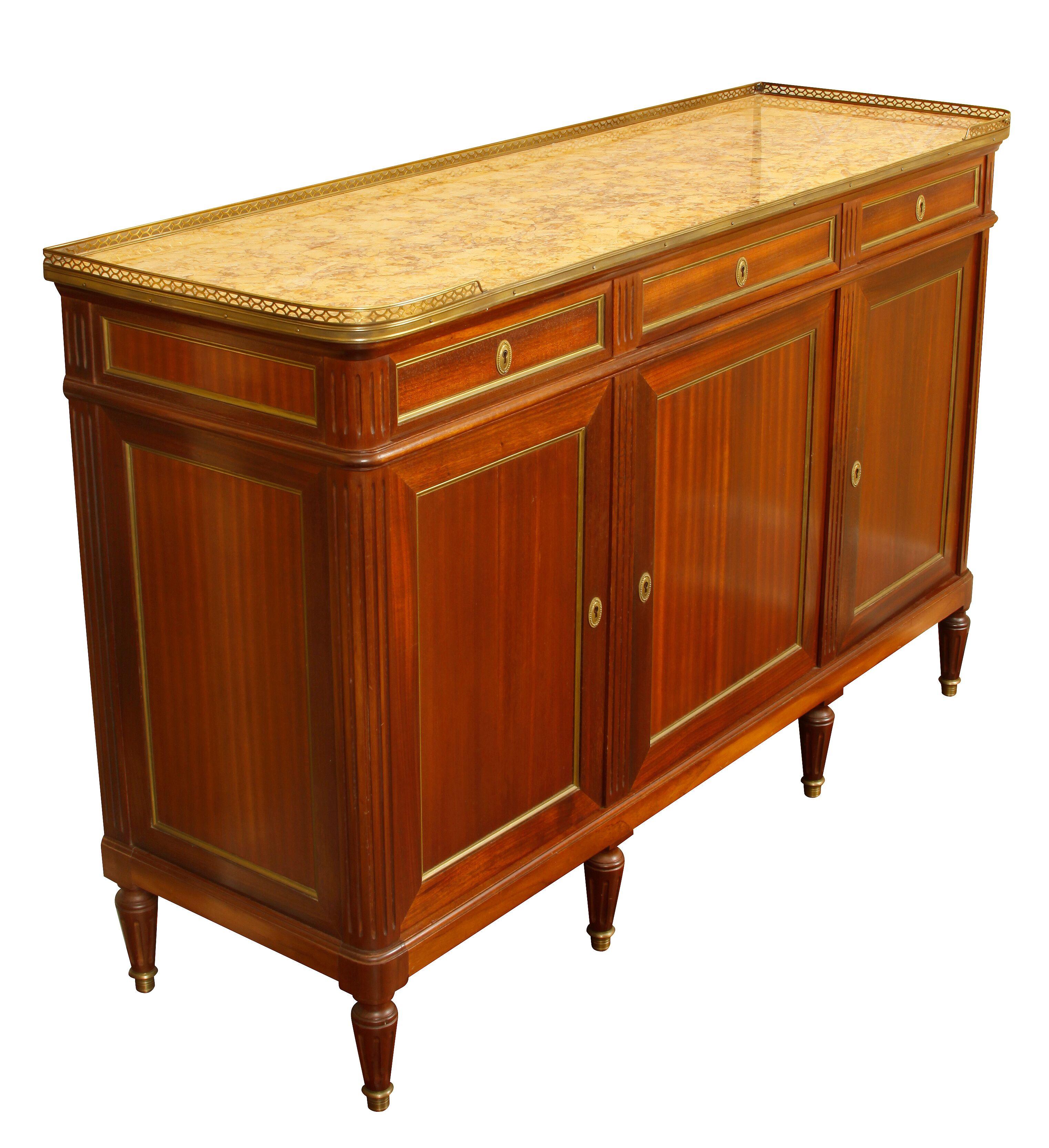 French mahogany Louis XVI style sideboard, circa 1940
Three doors with three slim drawers with bronze accents, marble top and bronze gallery.