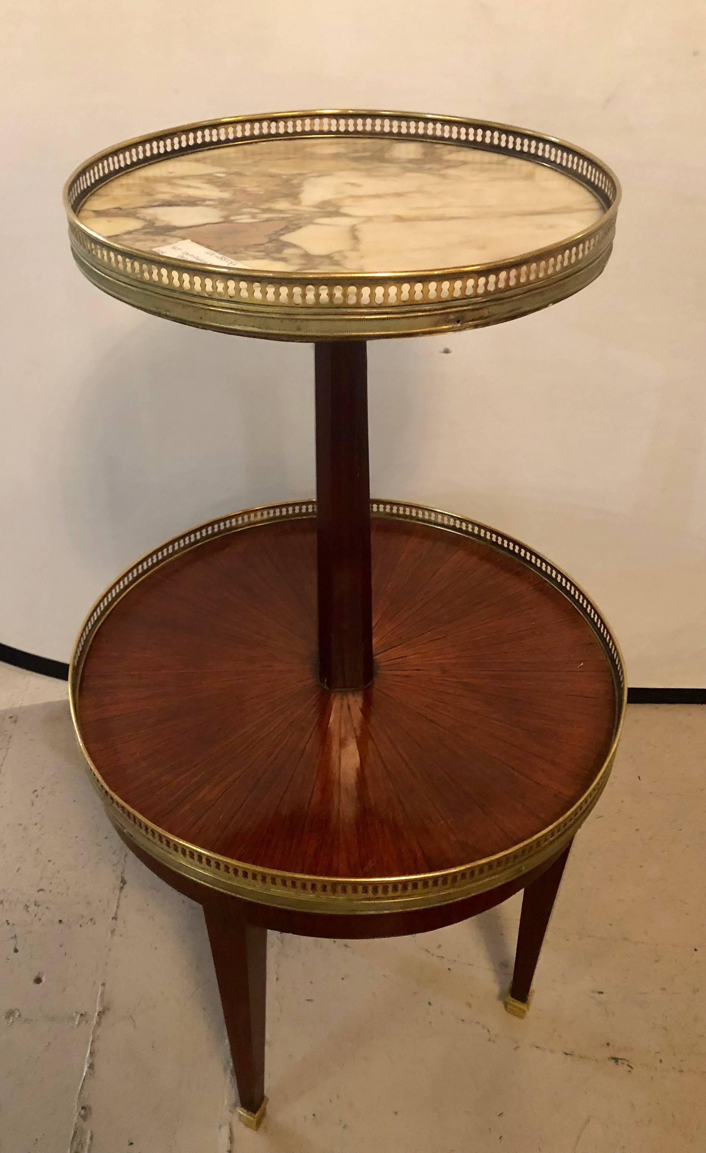 French mahogany marble top dumbwaiter / two-tier side table with brass gallery. Custom quality with pieced bronze galleried shelves.