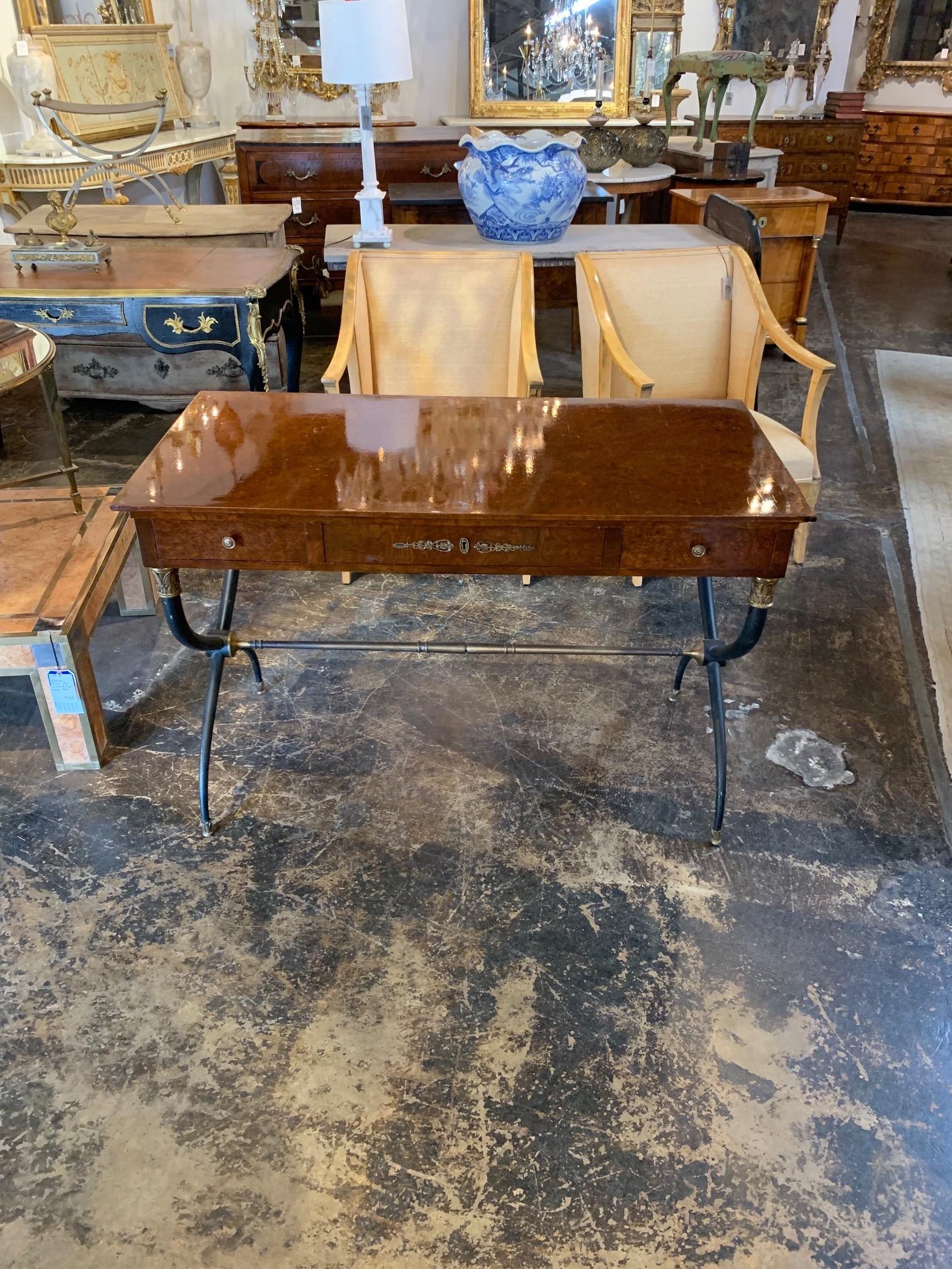 Gorgeous French mahogany midcentury Directoire writing desk on a painted steel base. Amazing polish and wood grain on the top. A fabulous piece that could go in a variety of decors!
