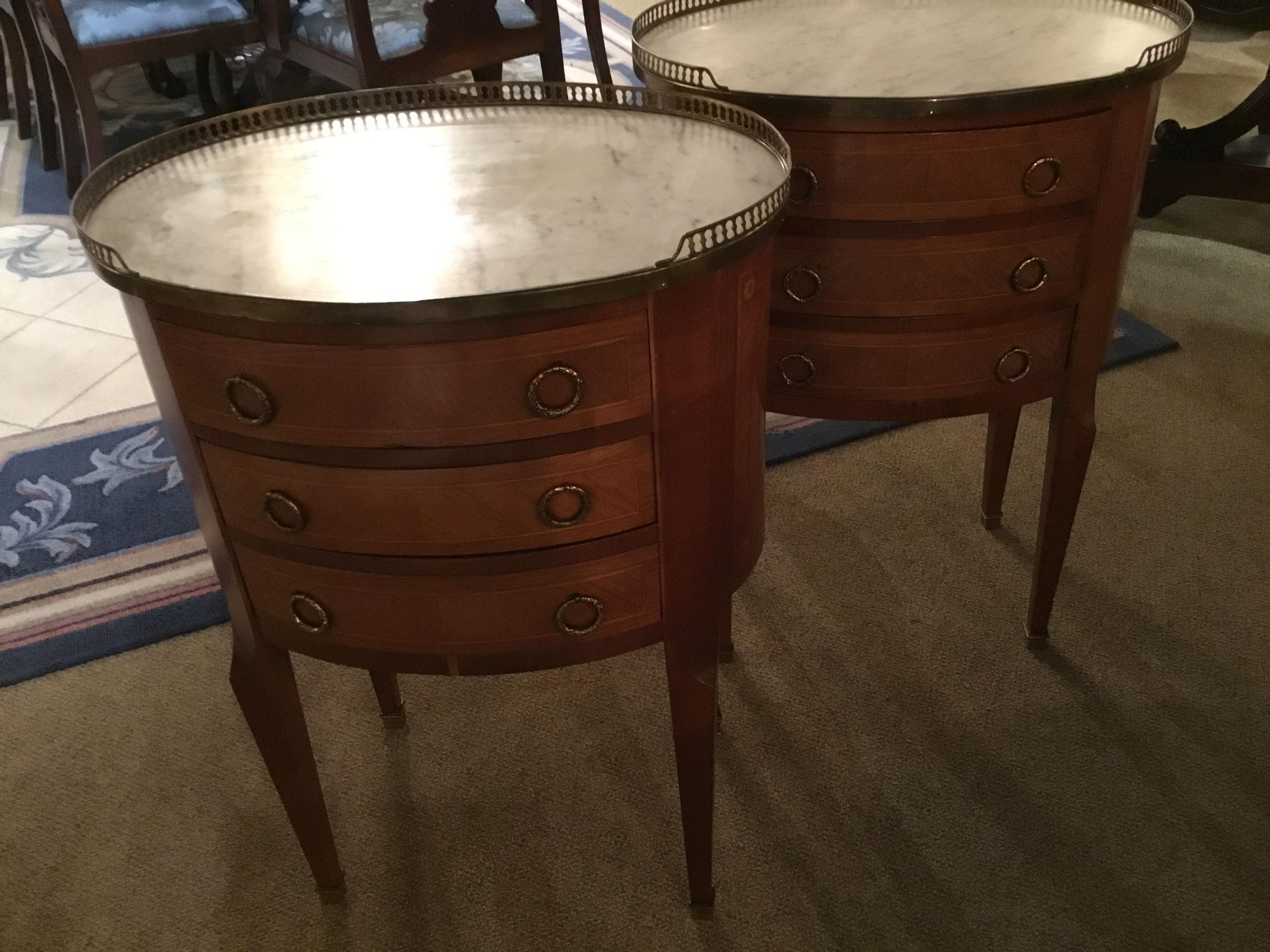 20th Century French Mahogany pair of occasional tables in oval form with marble tops