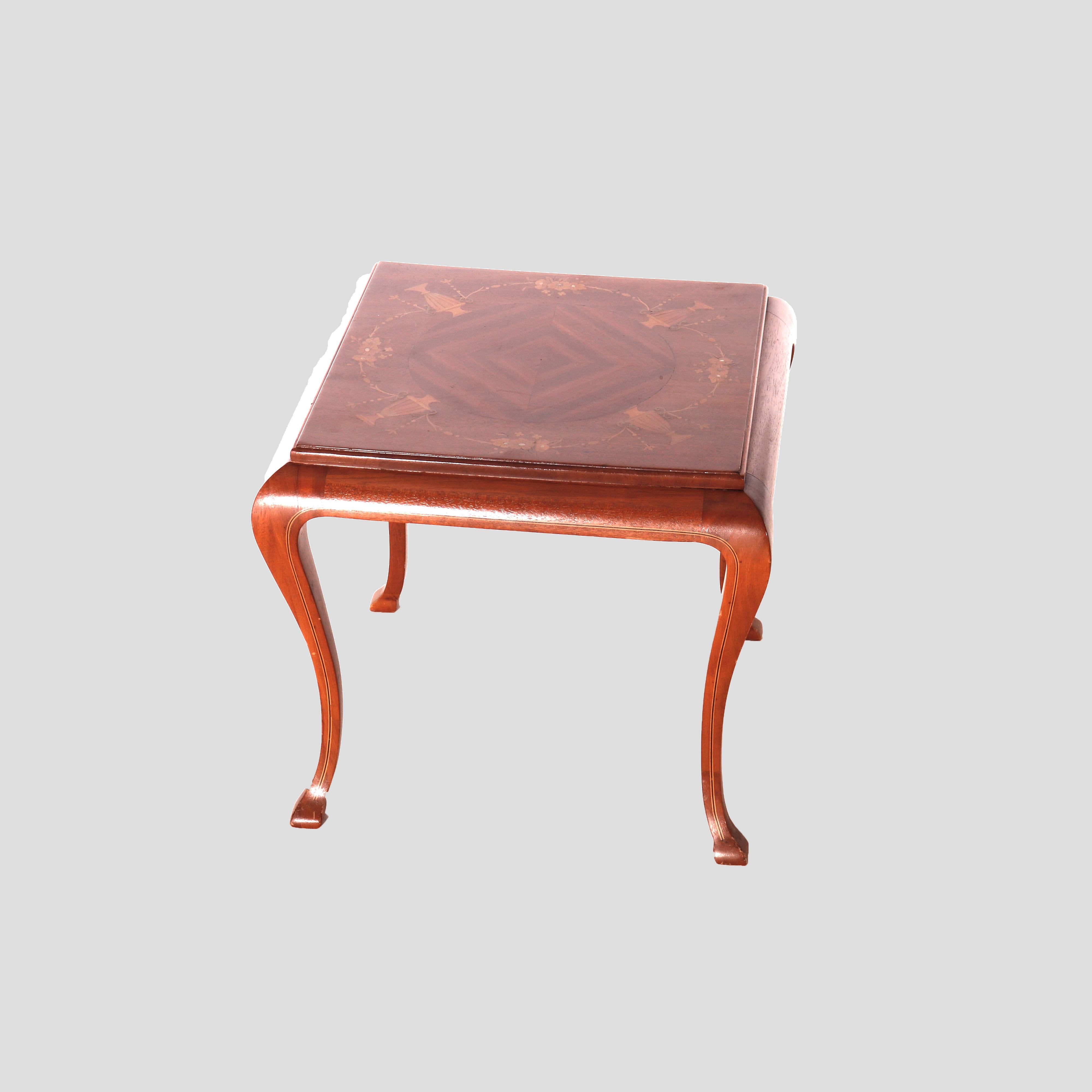 A French style side table offers mahogany construction with bookmatched top having satinwood marquetry urns, raised on cabriole legs, 20th century

Measures - 15