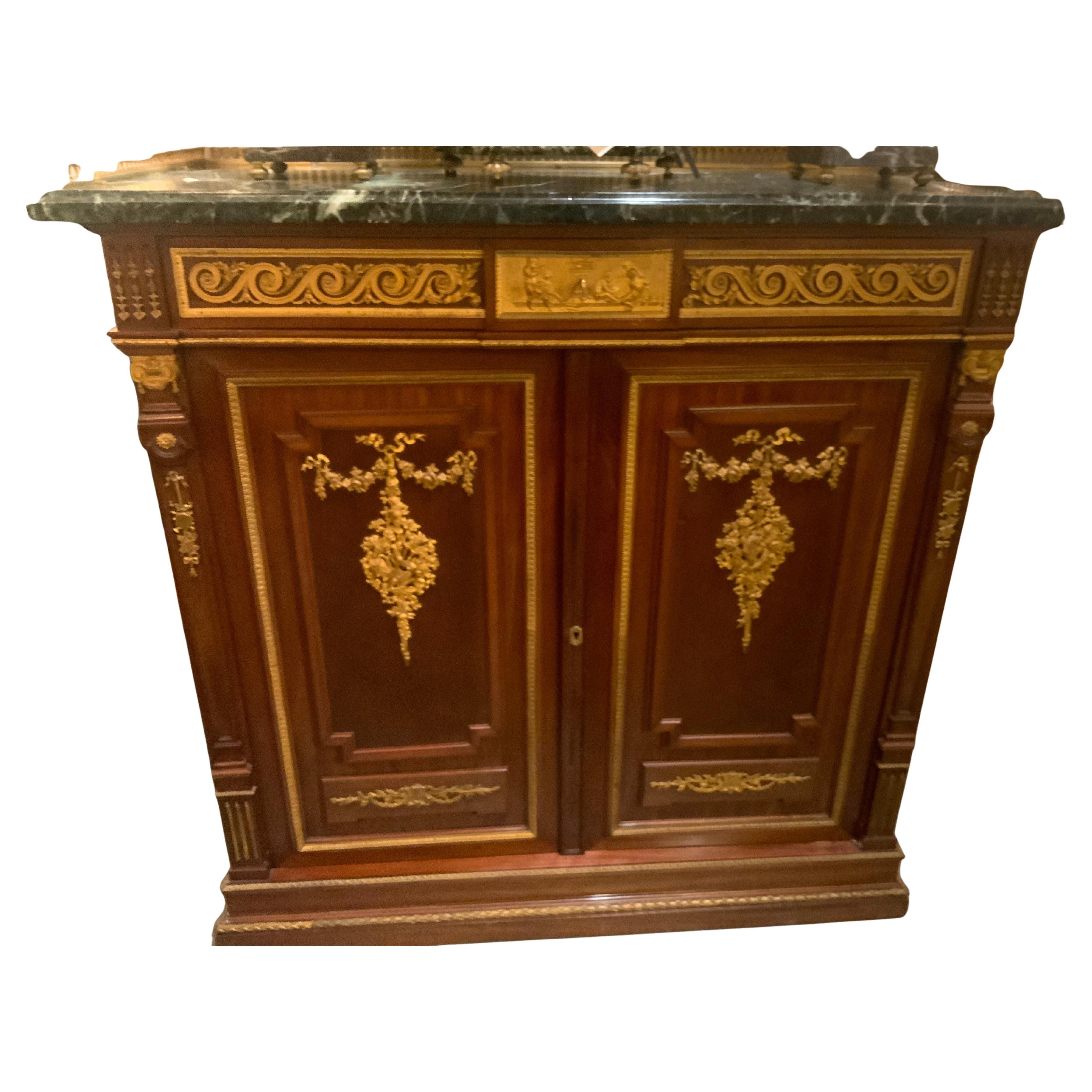 French mahogany two door cabinet with bronze dore elements For Sale