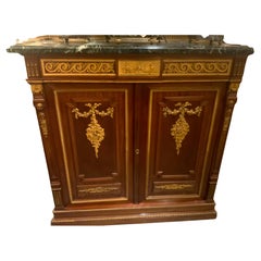 French mahogany two door cabinet with bronze dore elements