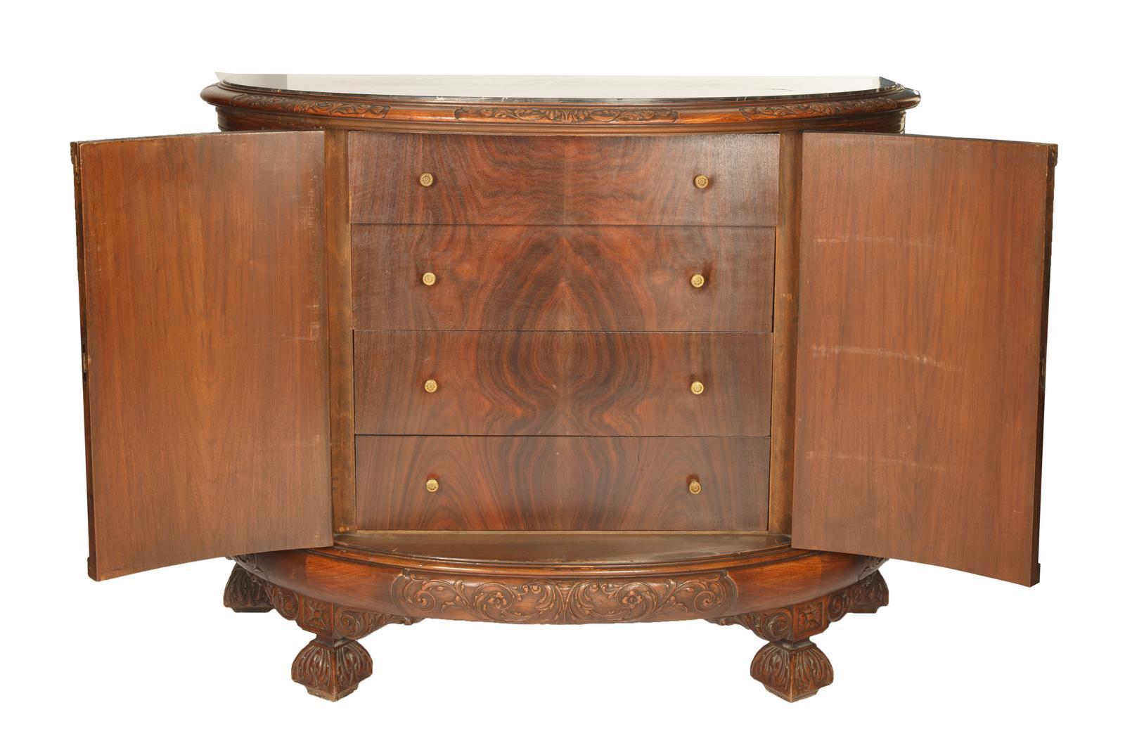 Elevate your dining area with this 19th Century French Hand-Carved Mahogany Wood Demilune Shape Sideboard or Server, a stunning piece of furniture that reflects the elegance and craftsmanship of the 19th century. The demilune shape of this sideboard