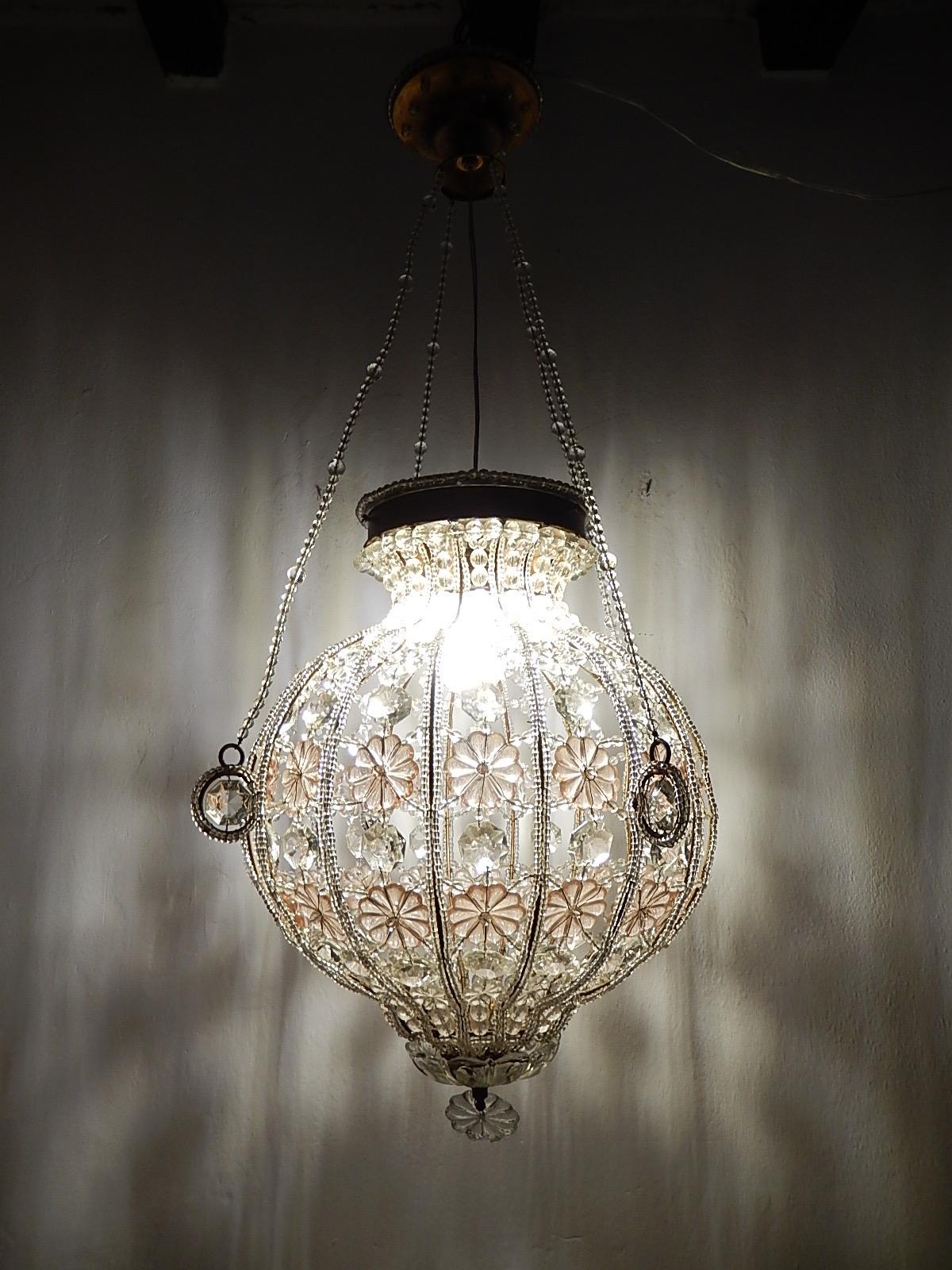 Housing 1-light, will be rewired with appropriate socket to country. A rare example of Maison Baguès. I have only seen small ones in this style. Clear crystals and florets with big pink florets as well. Beaded throughout, even the chains and canopy